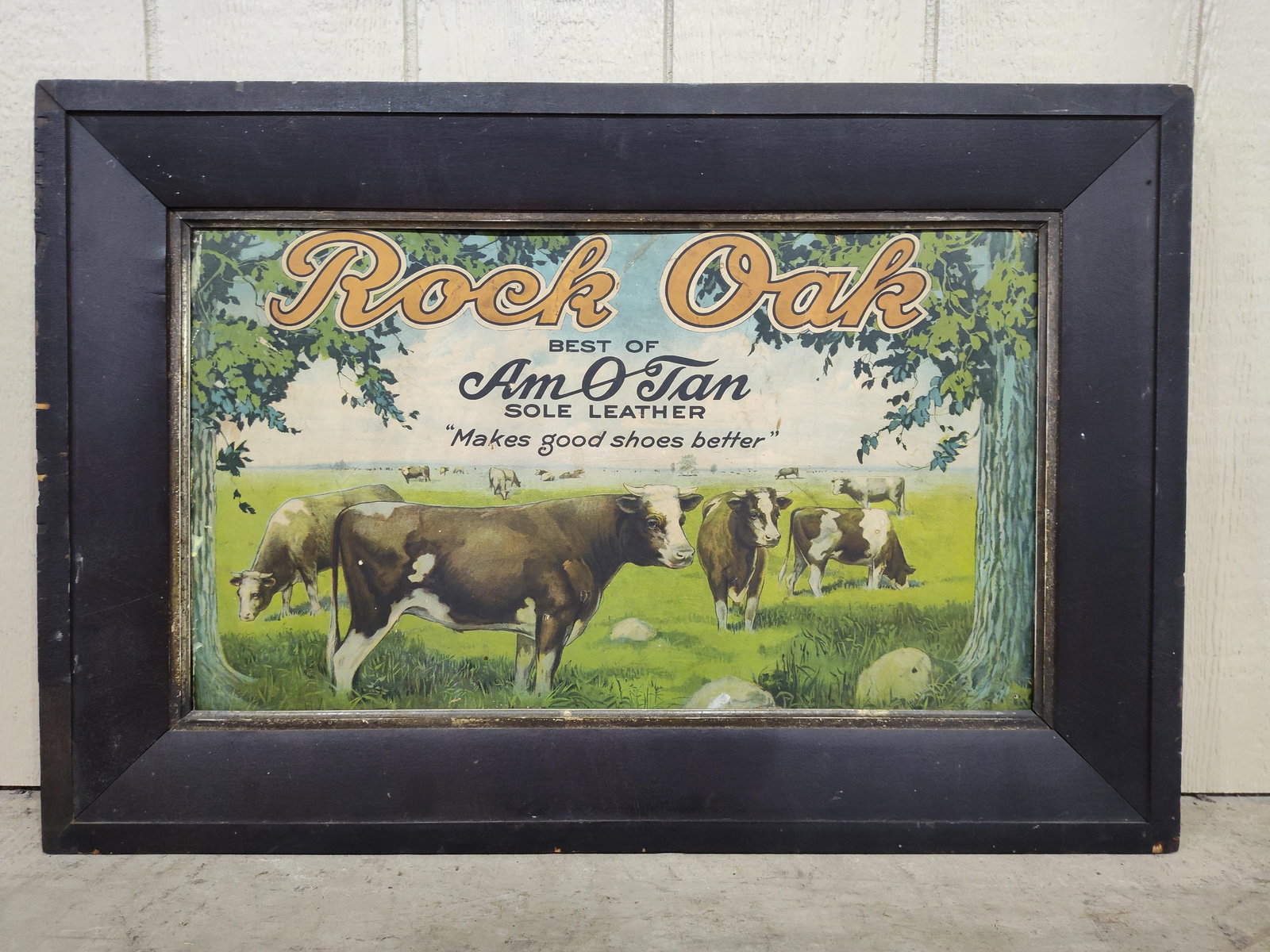 Great Graphical Rock Oak Sole Leather cdbd easelback in frame: This is a cardboard easelback sign in wood frame advertising leather shoe soles. Has a few small spots of a yellow substance of paint or glue along left edge and a repaired tear in a in oak but with