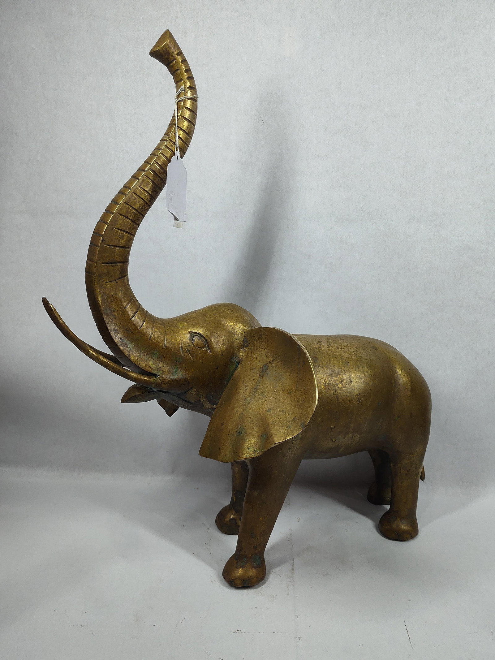 Brass Elephant Sculpture: Approximately 15in wide at ears and 24in tall to top of trunk.