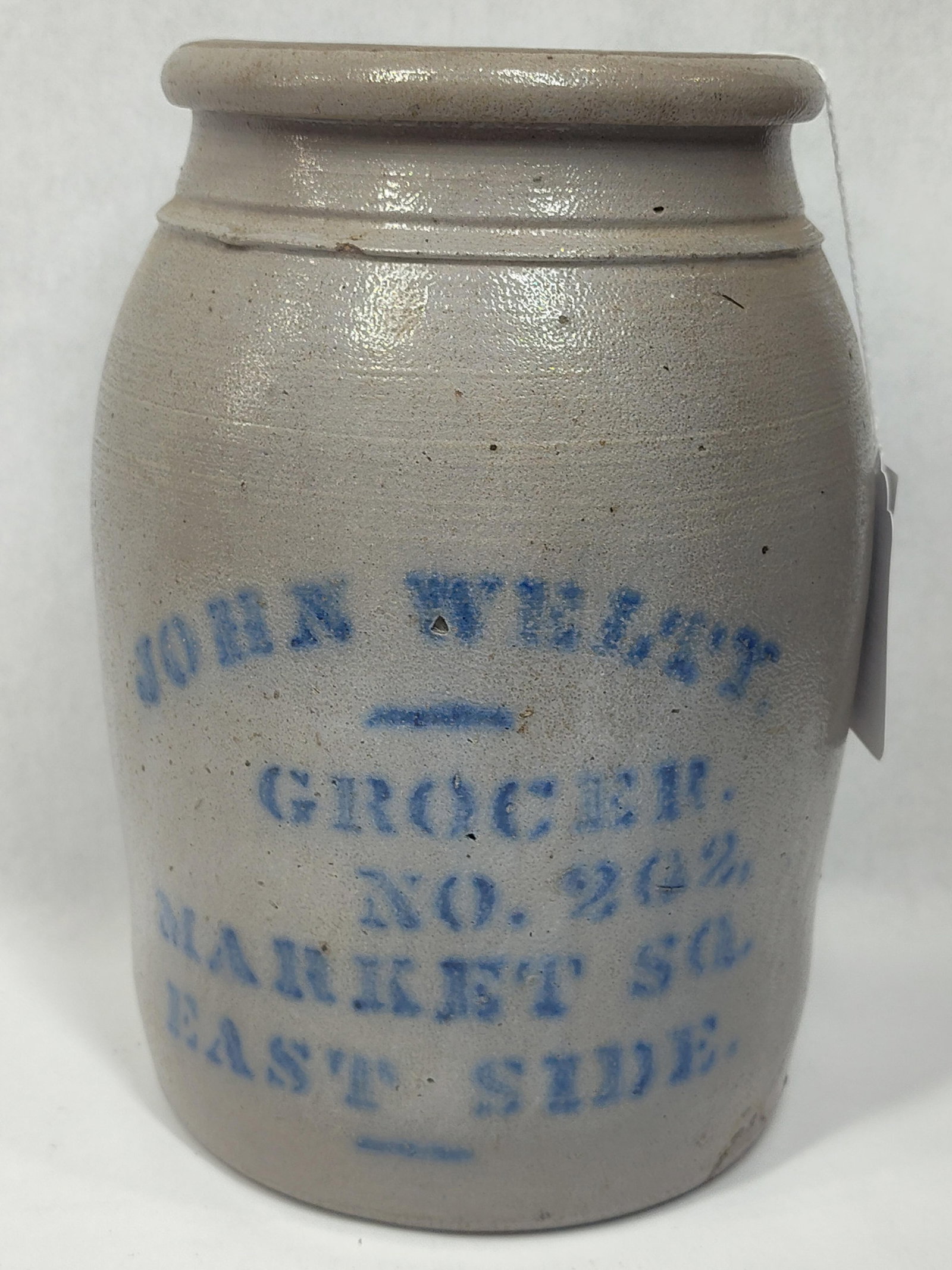 John Welty Grocer 1gal stoneware jar: Appears to have molding blemishes to bottom or may have been repaired? Is a great crack free piece! 9.75in tall.