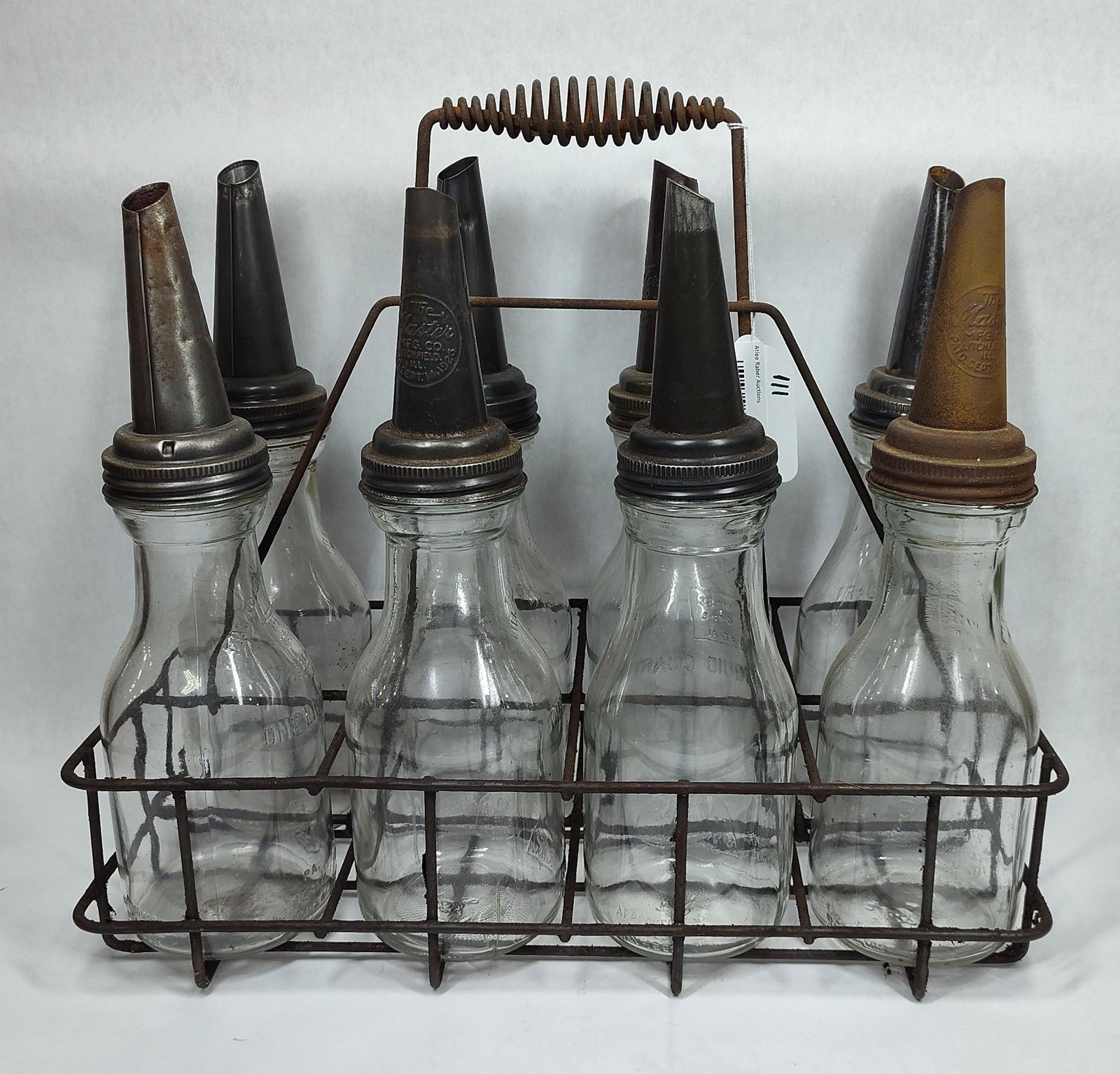 8-Glass Oil Bottles with carrier: All are identical.