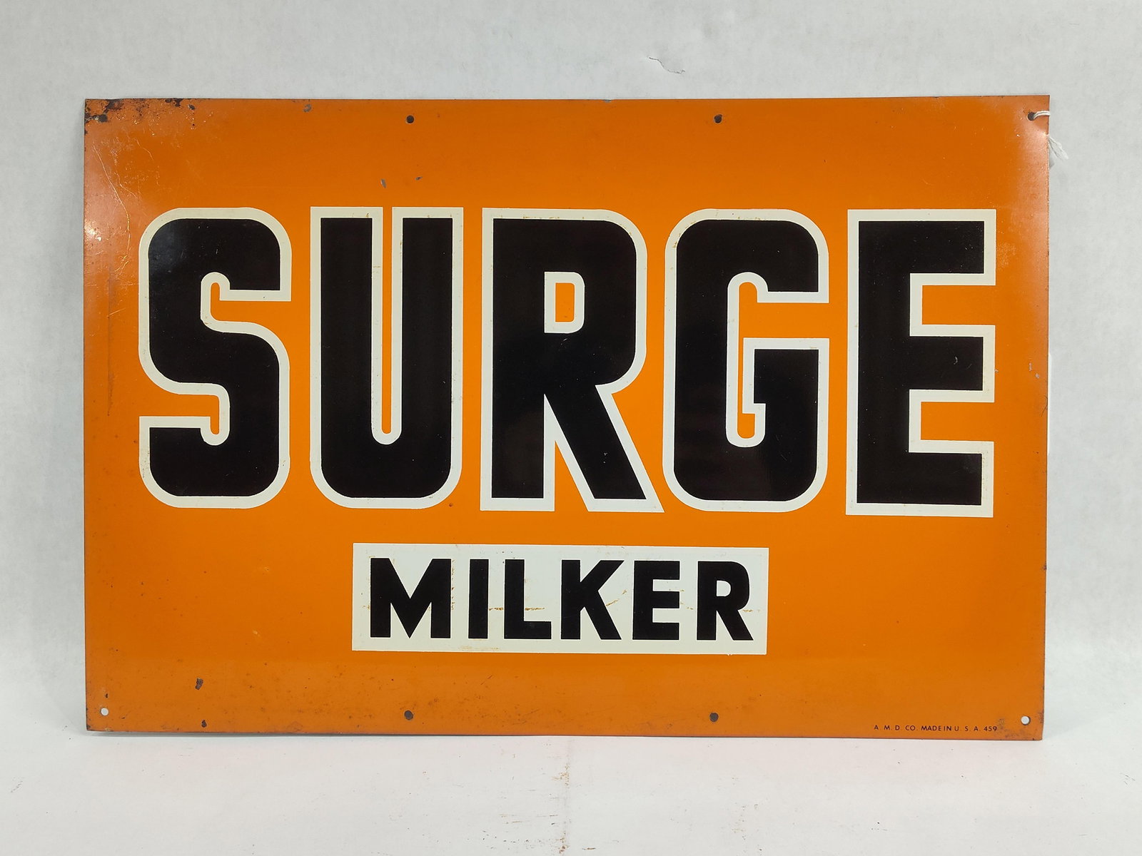 SST Surge Milker sign: 1-sided painted tin sign with minor edge wear but overall is good! 12in X 18in.