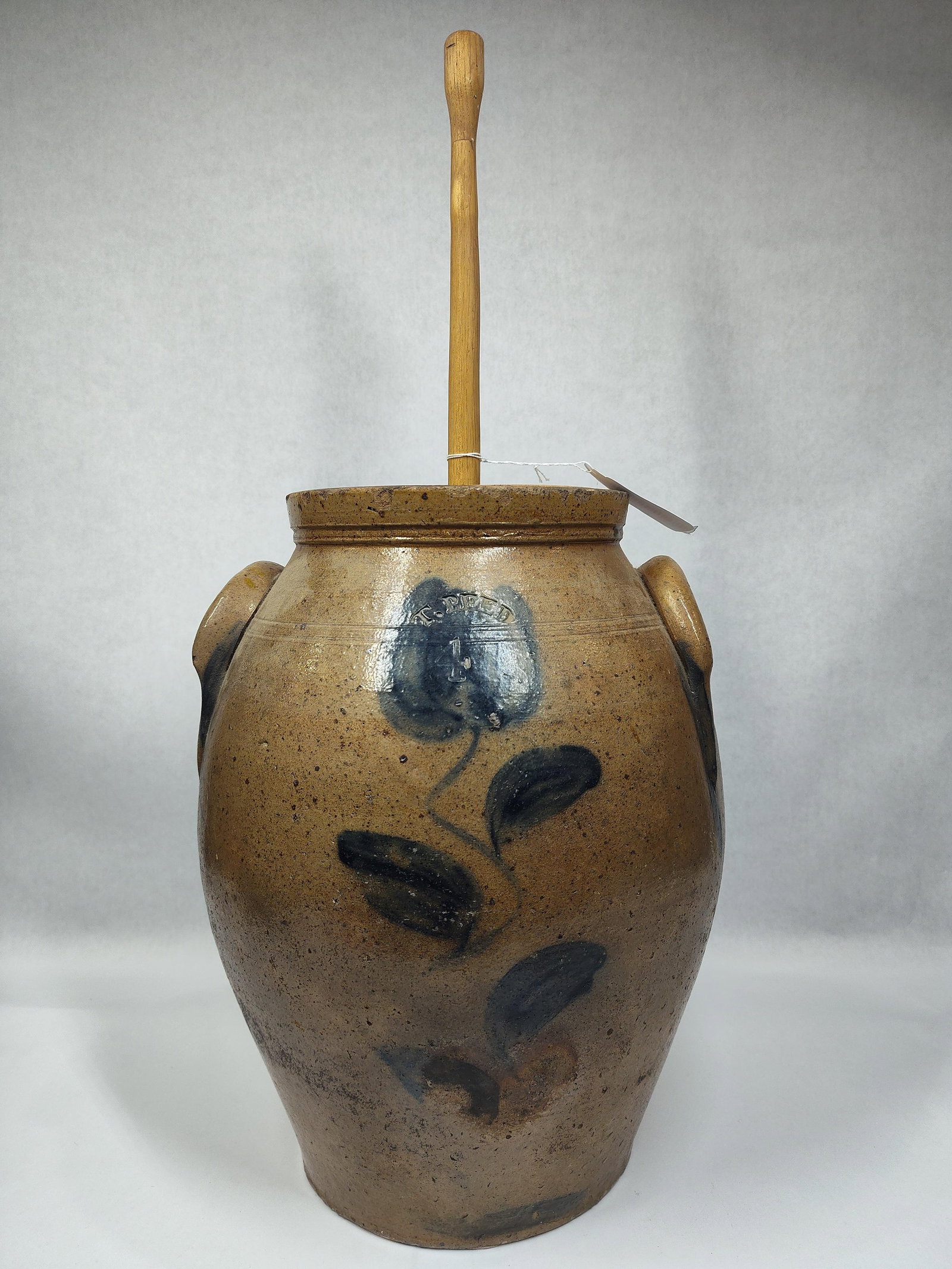 T. Reed Tuscarawas County 4gal Dasher Churn: Bottom has been repaired. Has a chip on interior rim and shows some discoloration, also shows a small 3in hairline from base on back side but has a great look! 15in tall.