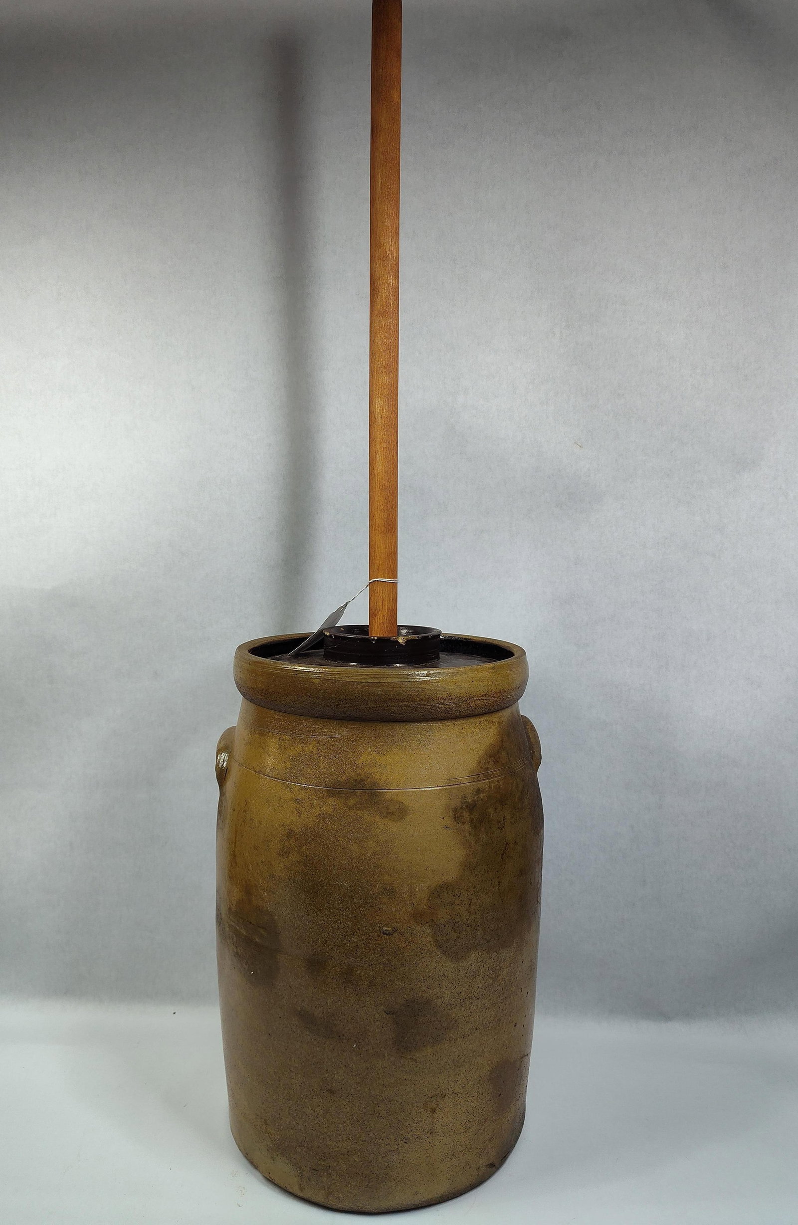 Stoneware 6gal Dasher Churn: Shows a few short hairlines from base and a few chips mostly along base, rim is clean. Cover Shows a few chips. 16.5in tall.