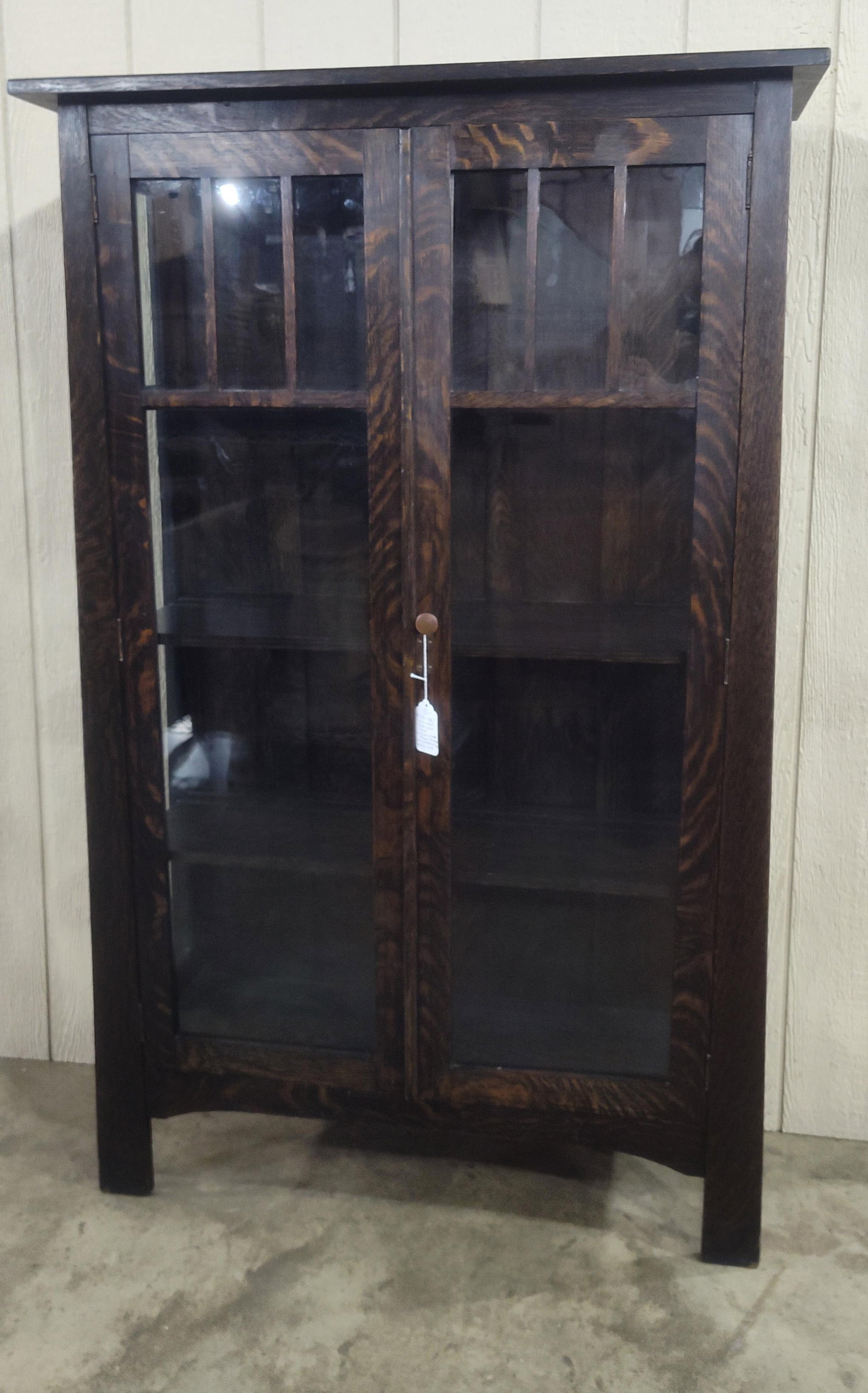 Great Mission Oak Arts & Crafts Period China Cabinet: Beautiful solid quartersawn Oak cabinet with good form, is wider at base than top. With 3 fixed interior shelves and in original finish!! 37in wide 15in deep 60in tall.
