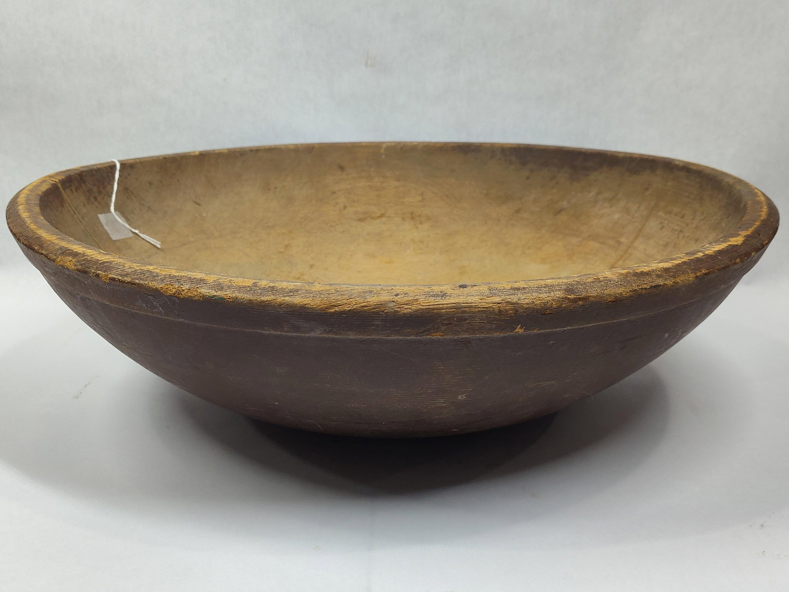 Early Primitive Painted Wooden Bowl: Great original paint but shows a 3in crack from rim. 17in diameter.
