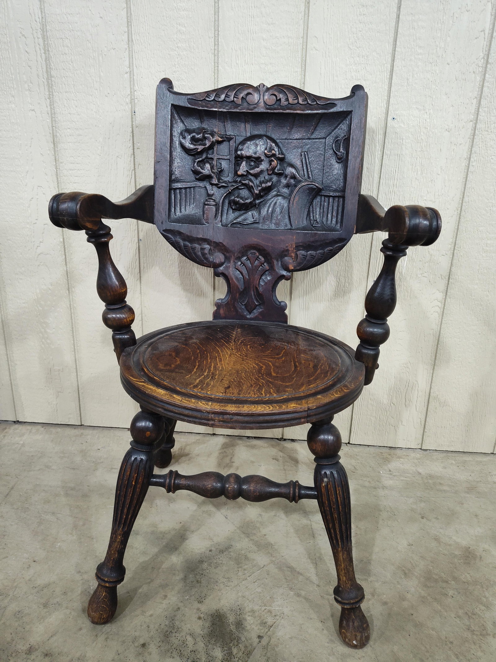 Early Victorian Oak Carved Chair of Gentleman Smoking Pipe: Interesting early carved chair depicting a gentleman smoking a pipe! Shows finish wear to seat and arms, also shows areas of minor separation at glue joints but is a good solid chair hardly ever