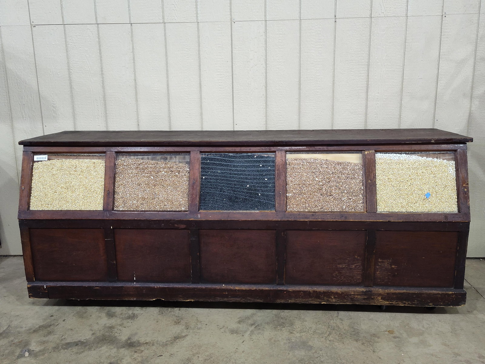 Early Country Store 7ft Seed/Bean Counter: Comparted 5- bin counter with open rear access and glass fronts for displaying seeds. Has a few broken and replaced trim pieces around glass. Shows period wear with a good early look!! 86in long