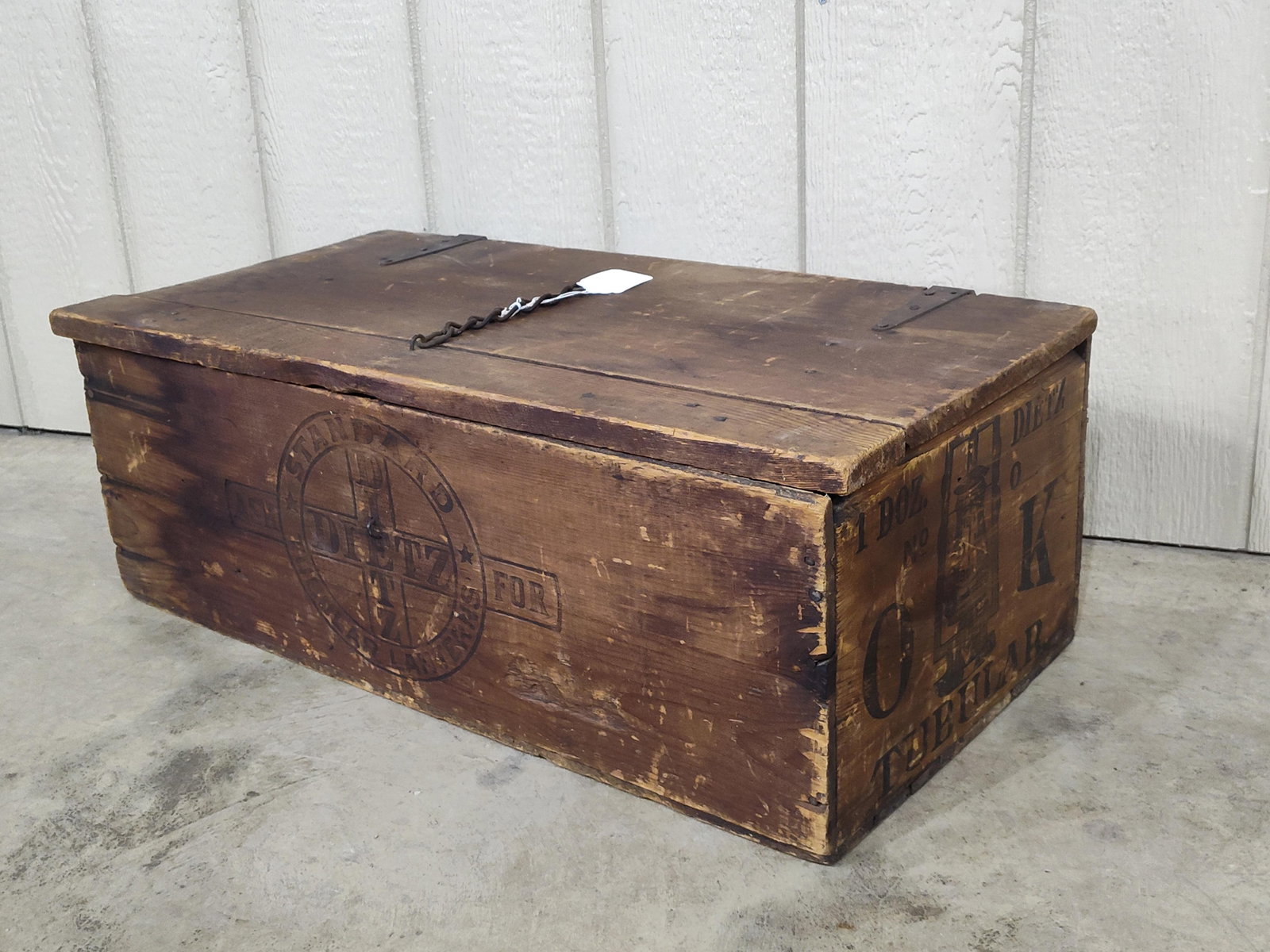Dietz Lanterns Shipping Box: With circular logo on front and back and nice lantern graphics on right side. 31in long 15in wide 11in tall.