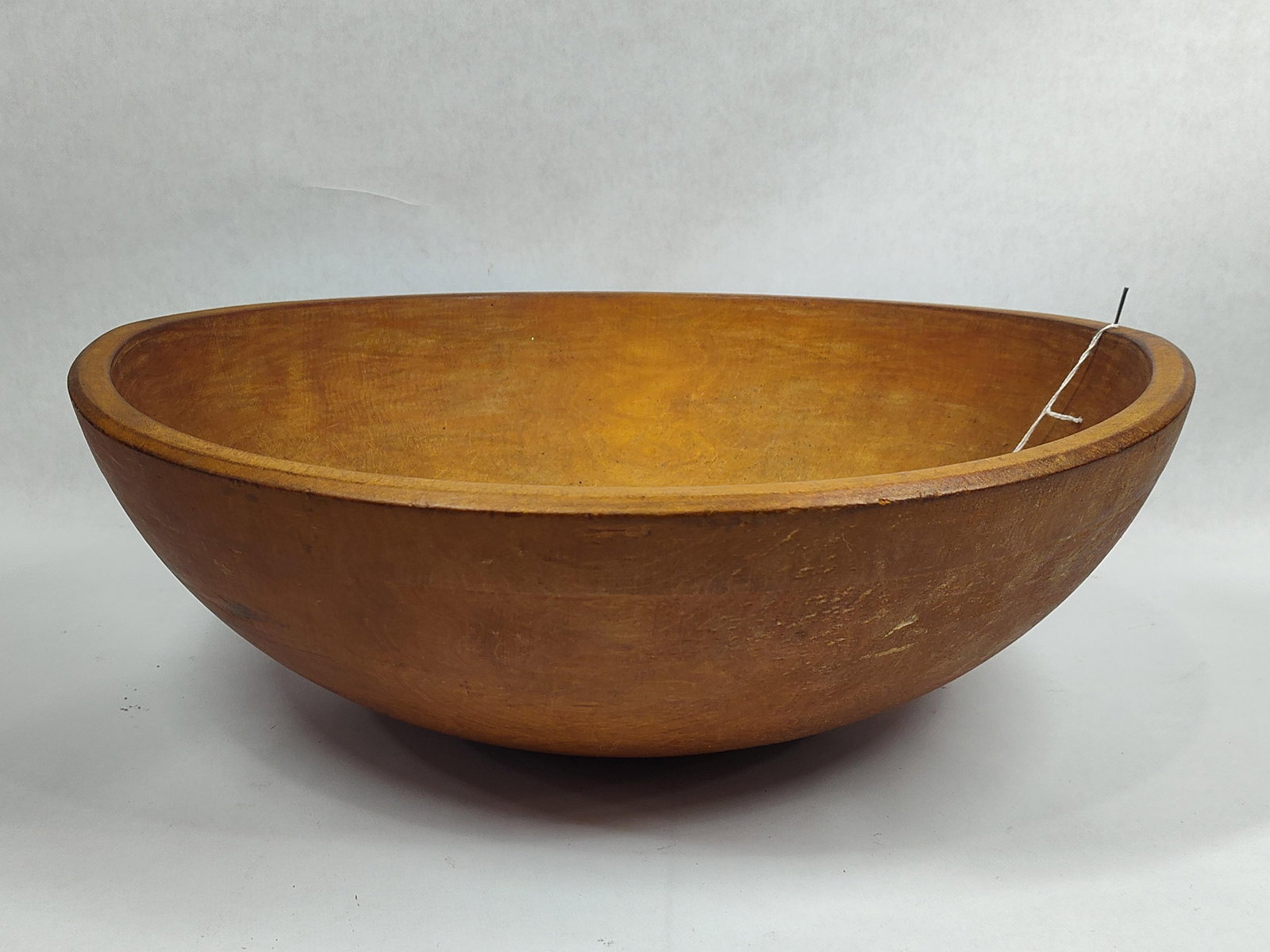 Primitive wooden butter bowl: 17in diameter.