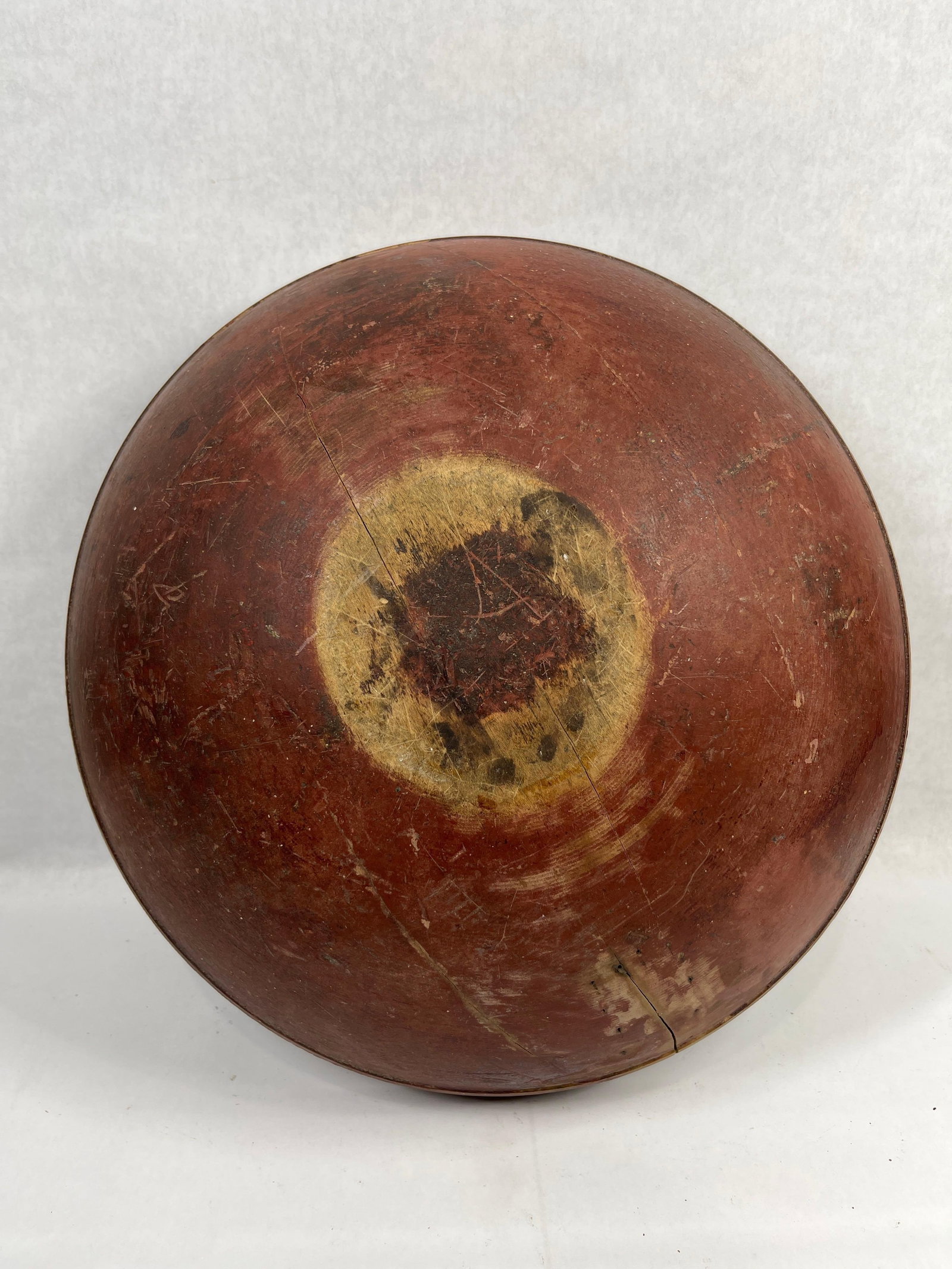 Red painted Dough Bowl: A split shows to inside, 17 inches in diameter with an early original paint. 