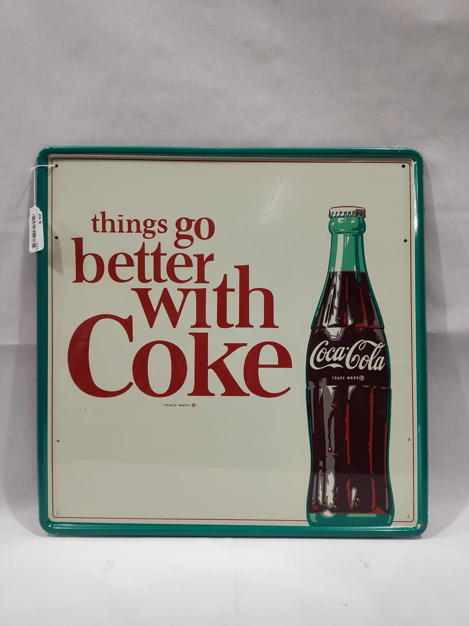 SST Coca-Cola self-framed sign: 1-sided painted metal self-framed sign with minor edge wear and a scuff in top center, otherwise is in excellent condition!! 23.5in x 23.5in.
