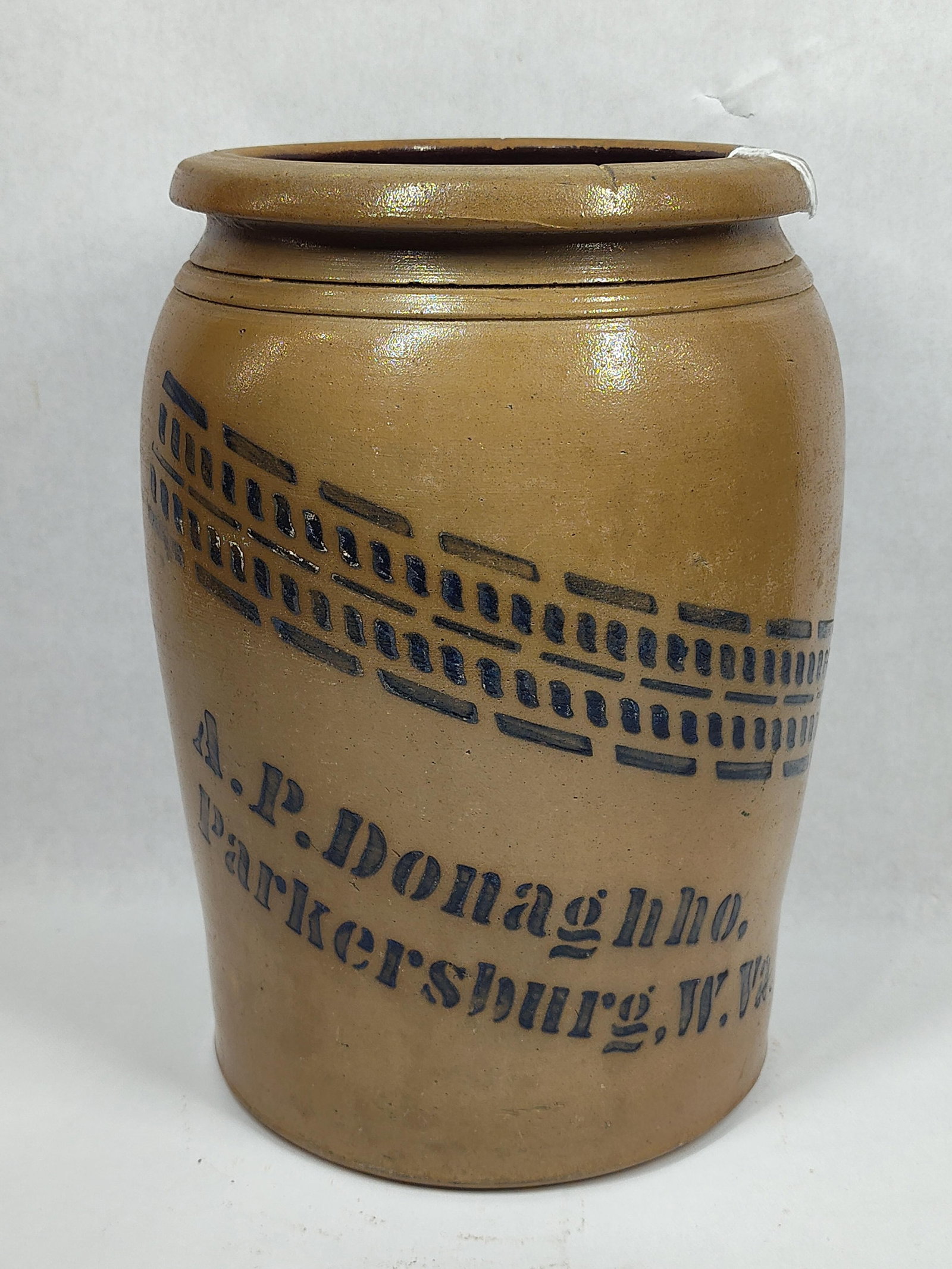 Decorated A.P Donaghho 2gal stoneware jar: With a chip on base edge, otherwise in excellent condition!! 12in tall.