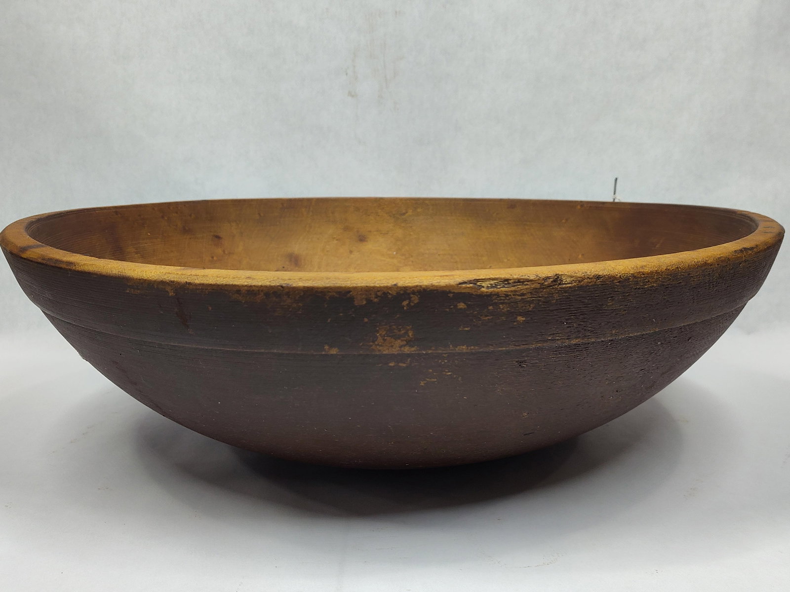 Primitive wooden bowl: 16in diameter.