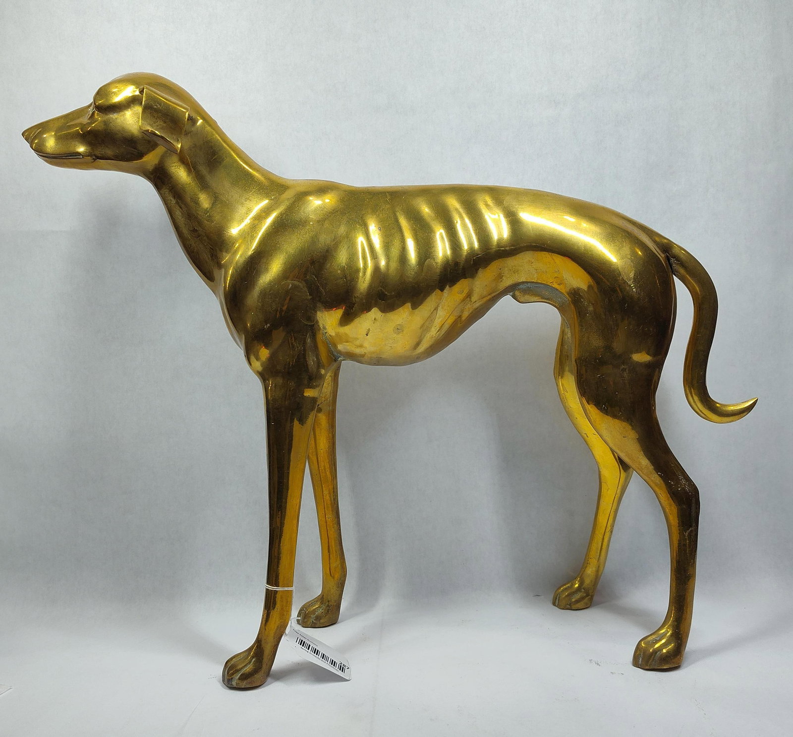 Mid Century Brass Greyhound Sculpture: Approximately 27in long 22in tall.