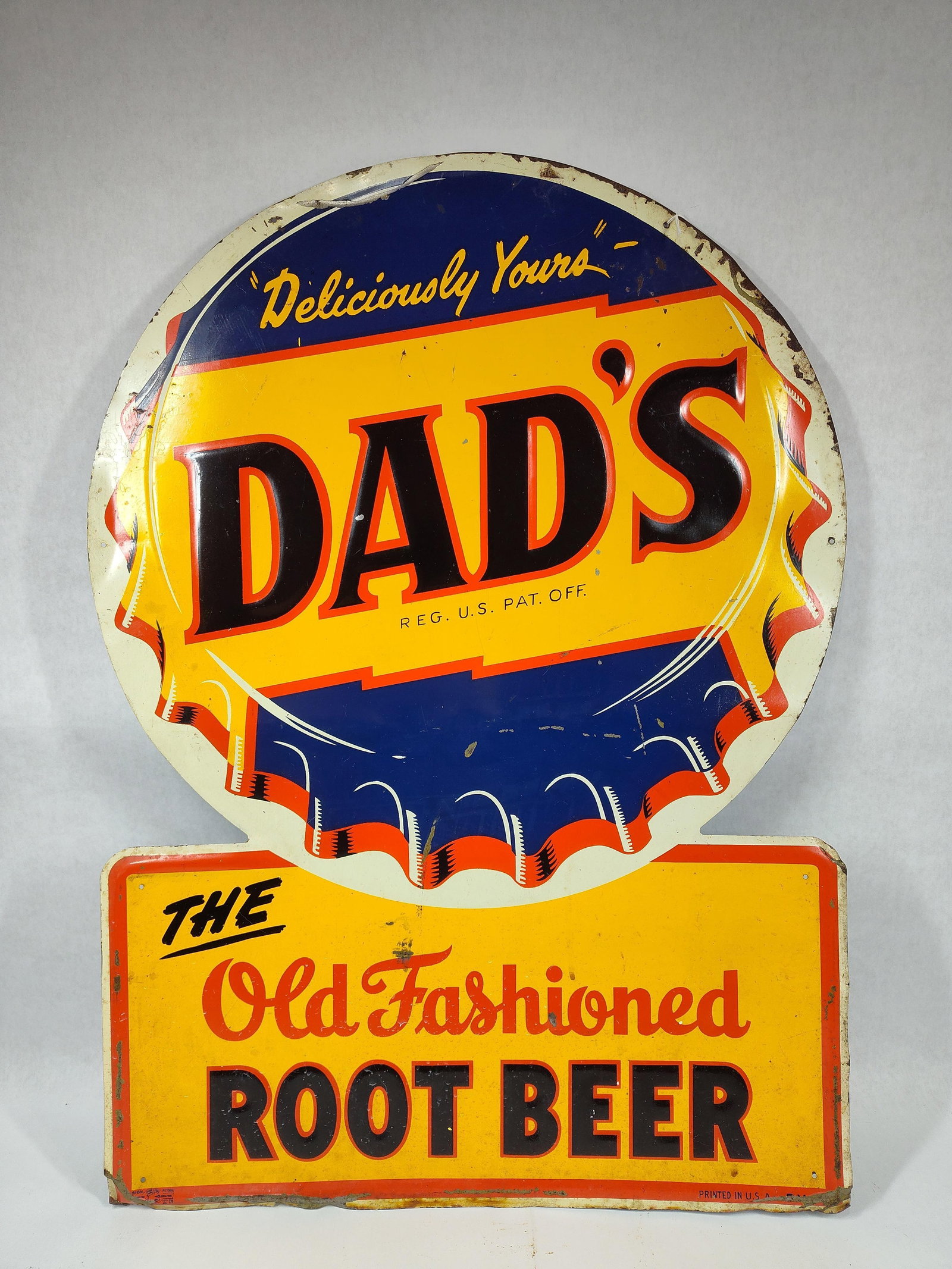 SST Dad's Root Beer embossed Keyhole shaped sign: 1-sided painted metal embossed and die cut sign. Shows some scuffing and scratches and a dent in center but displays well! With Union Label stamp in lower left corner. 20in x 28in.