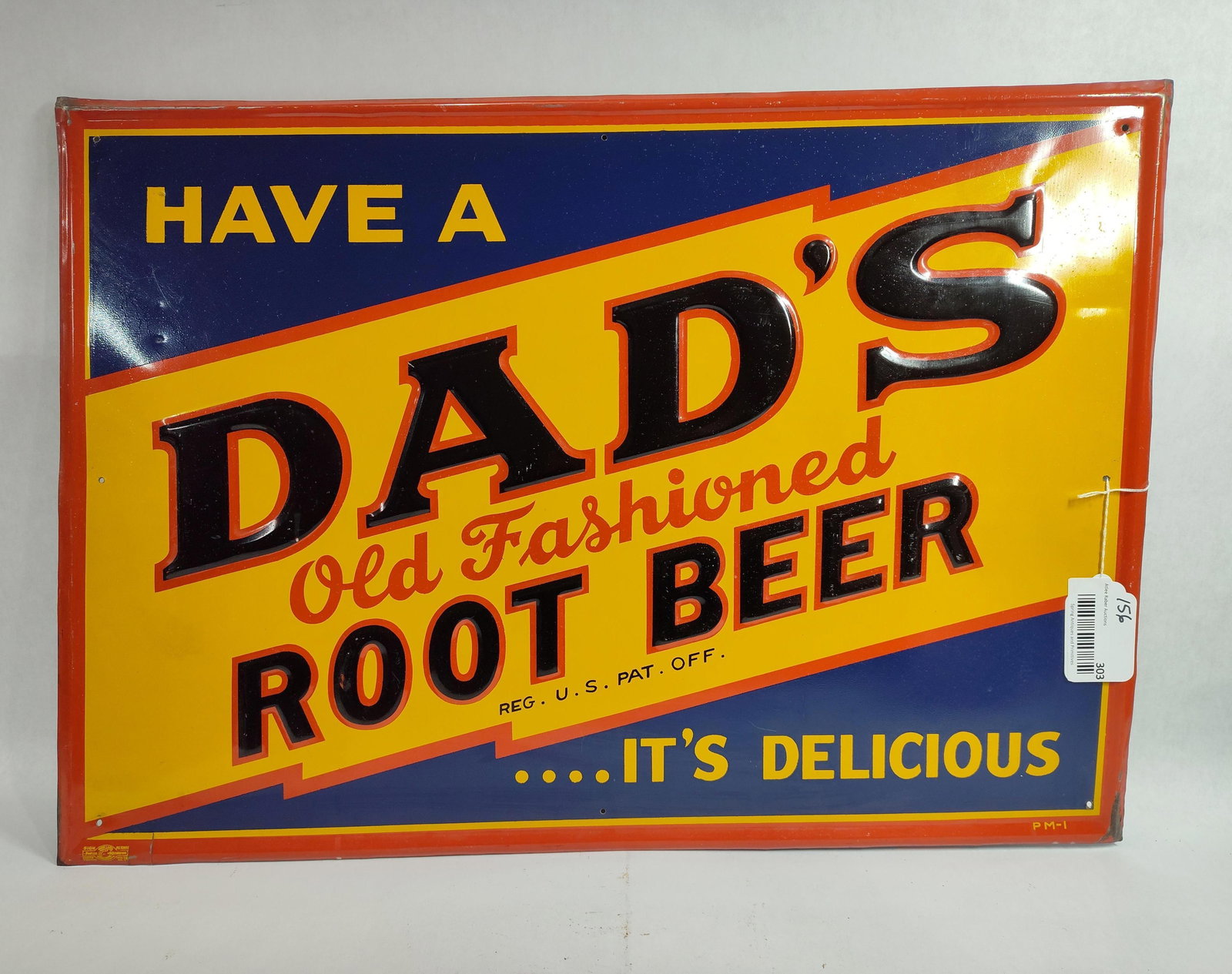 SST Dad's Root Beer embossed sign: 1-sided painted metal self-framed and embossed sign with minor edge wear and 2 small cuts in bottom left edge but field with good gloss. With Union Label stamp in lower left corner. 19in x 27in.