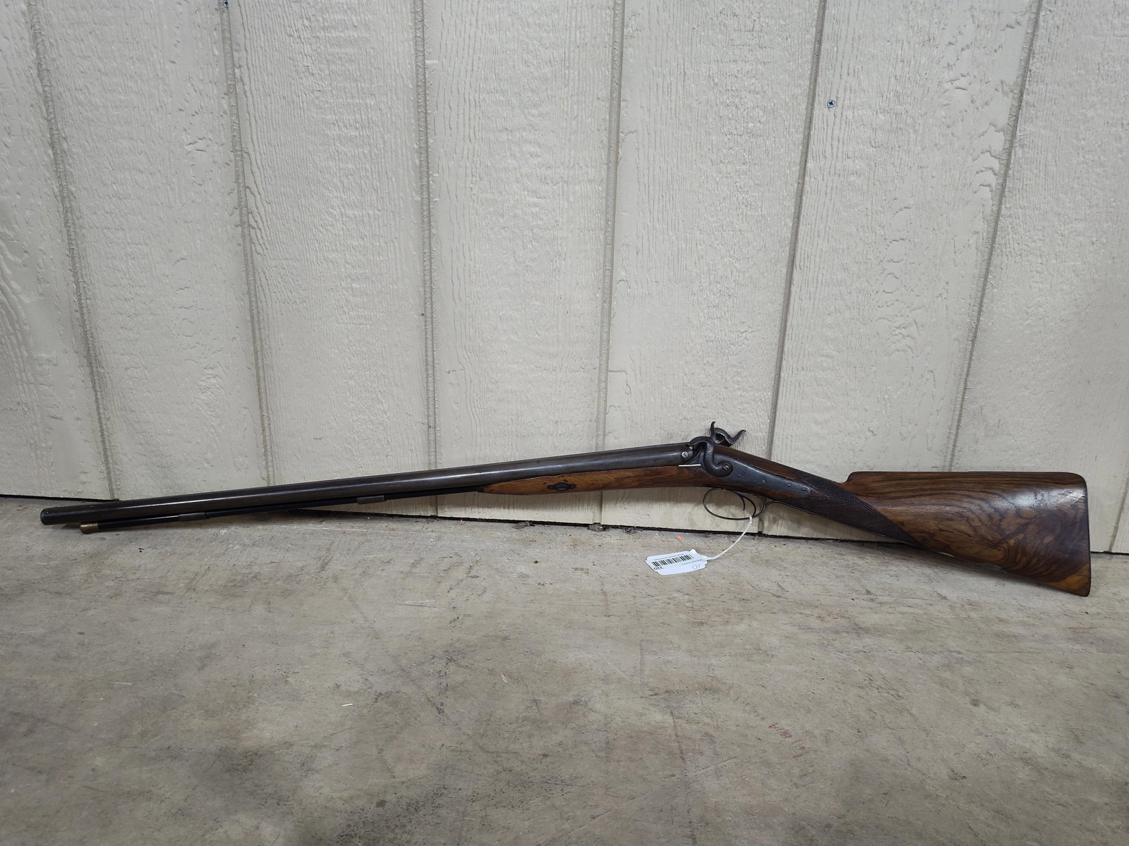 Spang & Wallace side by side Percussion Rifle: Early rifle with a cracked stock and firing mechanism does not function properly. Buying it as a wall hanger. Unsure of caliber.