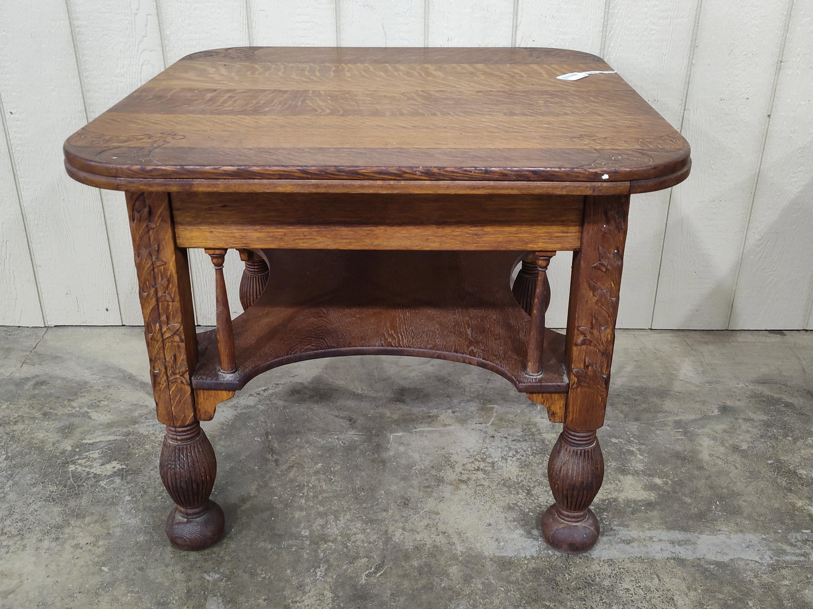 Fancy Carved Quartersawn Oak 1-drw Table: Early solid oak single drawer table with ornate leaf carvings and bun feet. Shows a few minor chips in leaf carvings on legs but overall in good solid condition!! Top is 36in x 36in 29.5in tall.