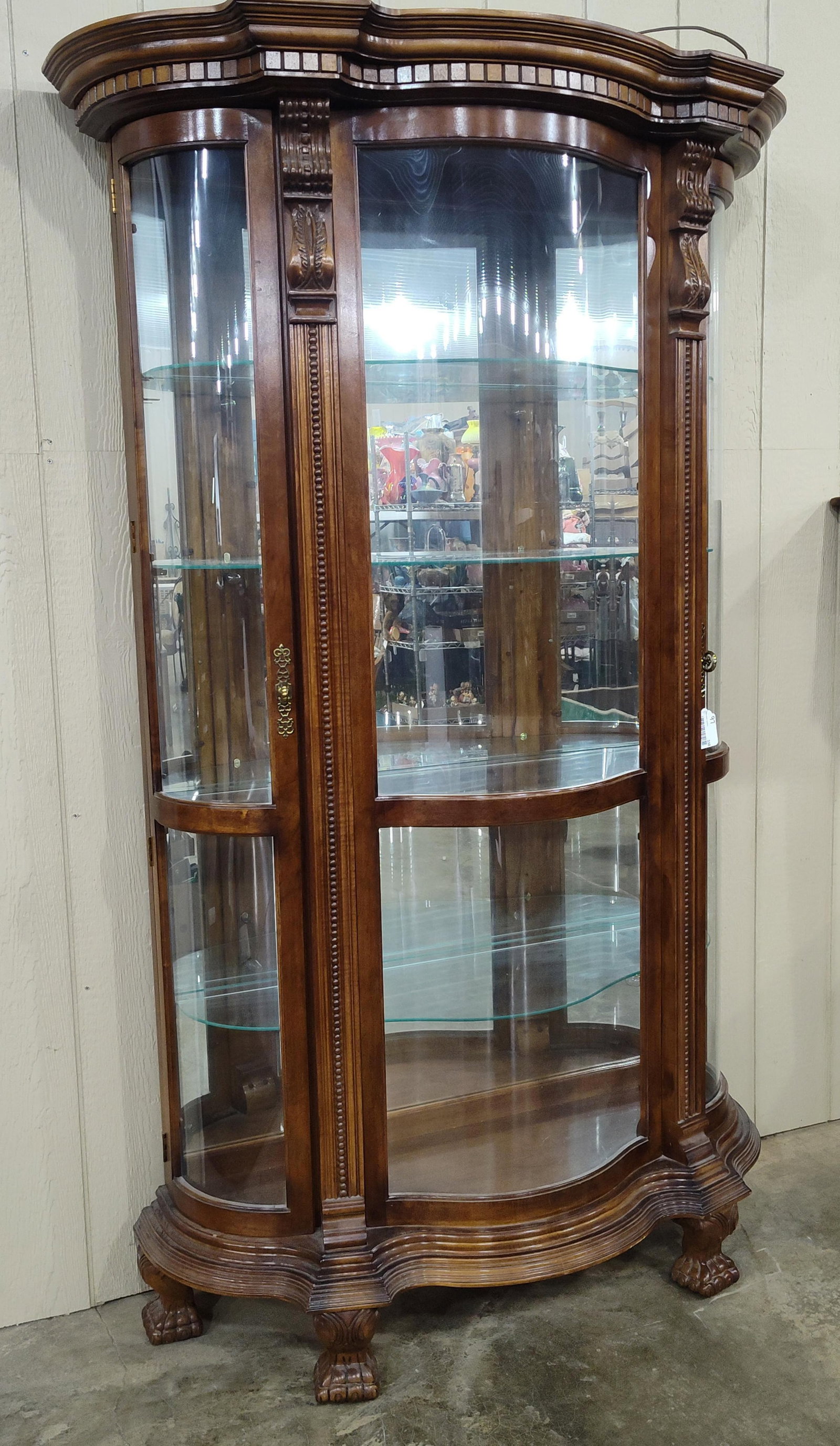 Tall Pulaski Empire Style Curved Glass Curio Cabinet: Fancy carved curved glass lighted curio with side wing doors on each side! Great condition!! 50in wide at top crown 19.5in deep 82in tall.