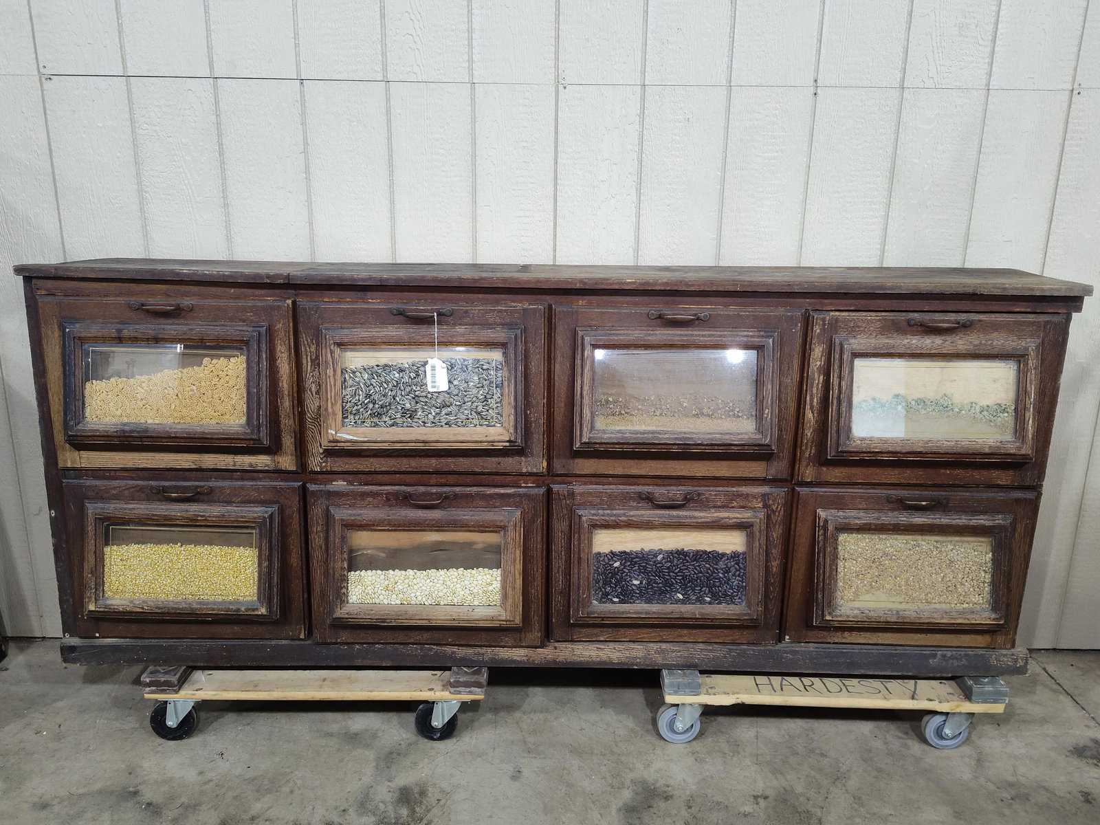 Early Country Store 8-Bin Seed Counter: Appears this was a built in counter, has 8 tilt out bins with seed display fronts. 87in long 13in wide 36in tall.