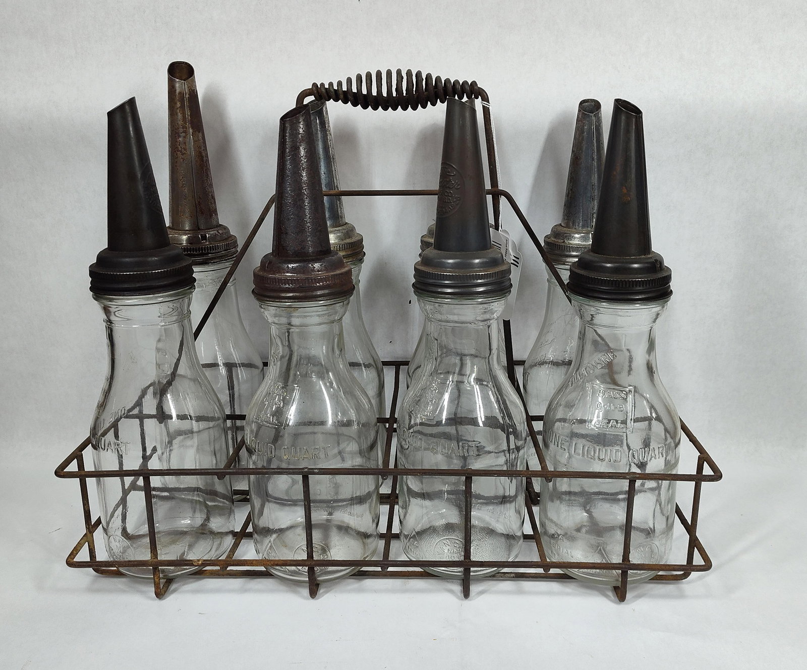 8-Glass Oil Bottles with carrier: All are identical.