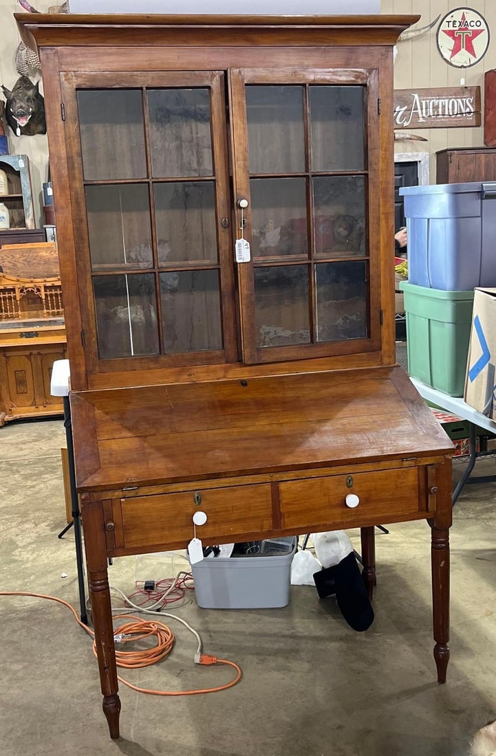 Early 2pc Slant Front Plantation Desk/Bookcase: Nice early 2pc cabinet/desk with early wavy glass panes and 2 fixed shelves in top, bottom with hinged slant front cover, cubbie interior and 2 drawers. Shows period wear but really nice condition