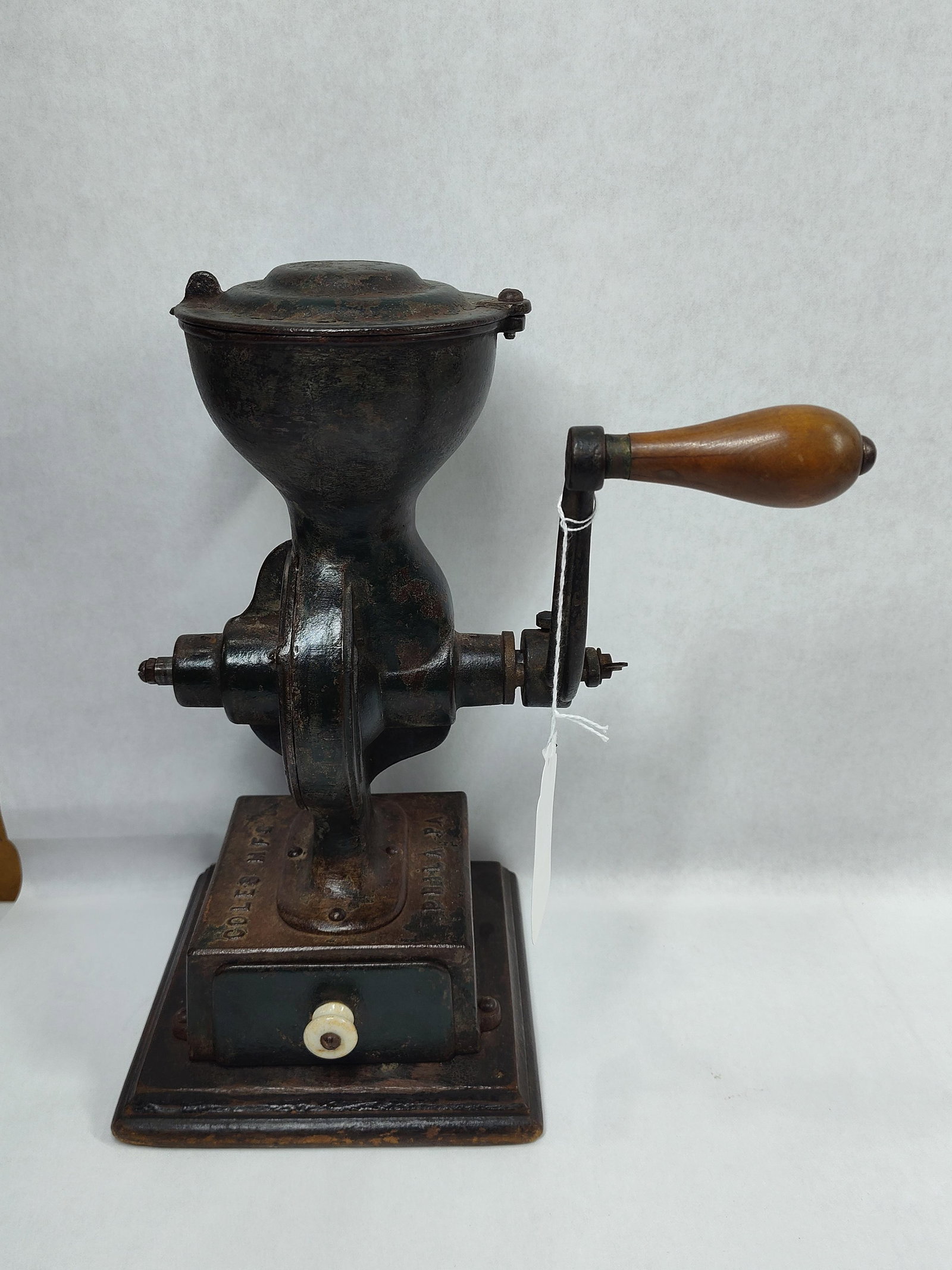 Early Coles Mfg Co Coffee Mill: All original, showing some wear to original paint. 12in tall.