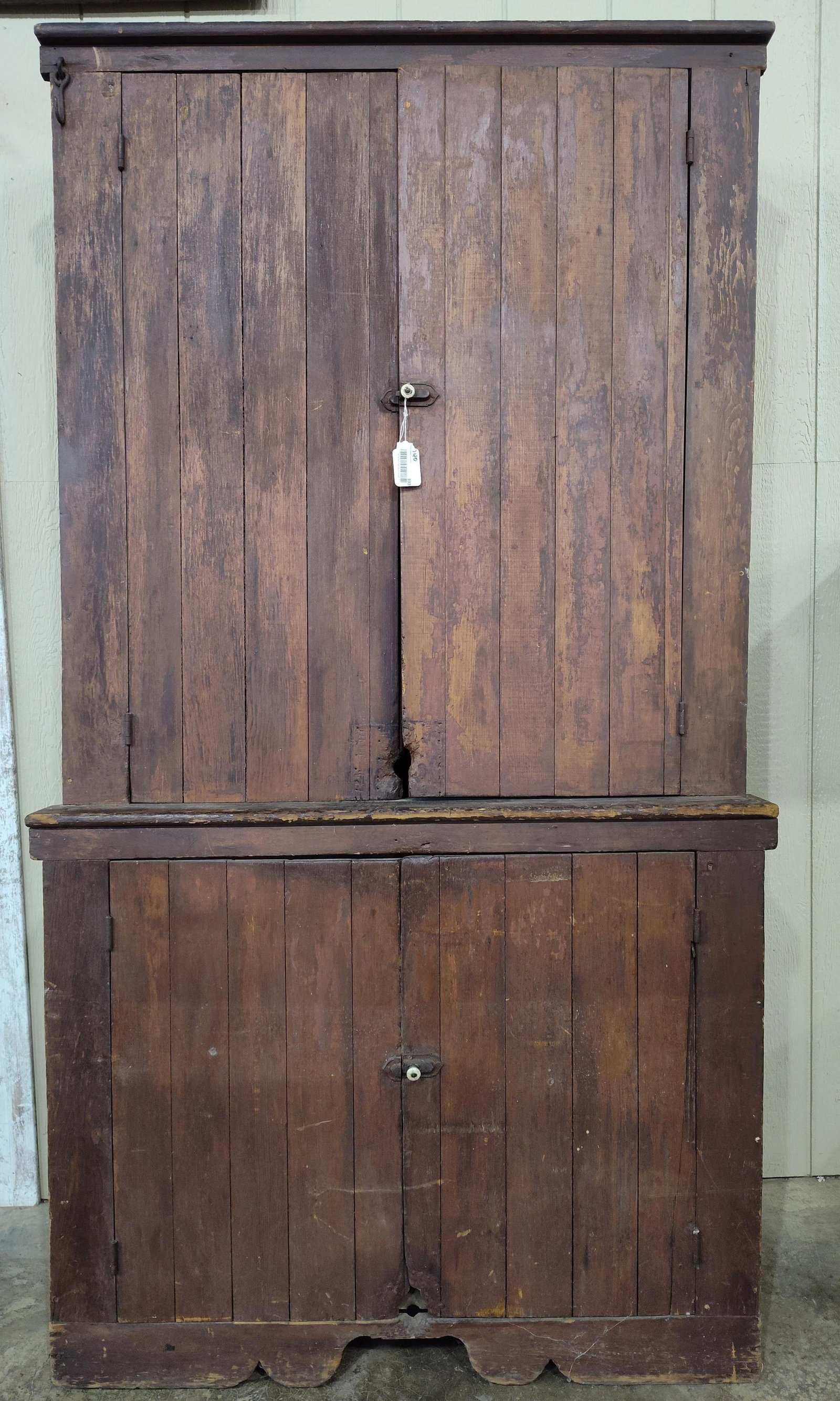 Early Primitive Sq Nailed Stepback Cupboard: Early 1 piece cupboard with slatted doors, with mouse gnawing character at bottom of doors. 45.5in wide 17.5in deep 85in tall.
