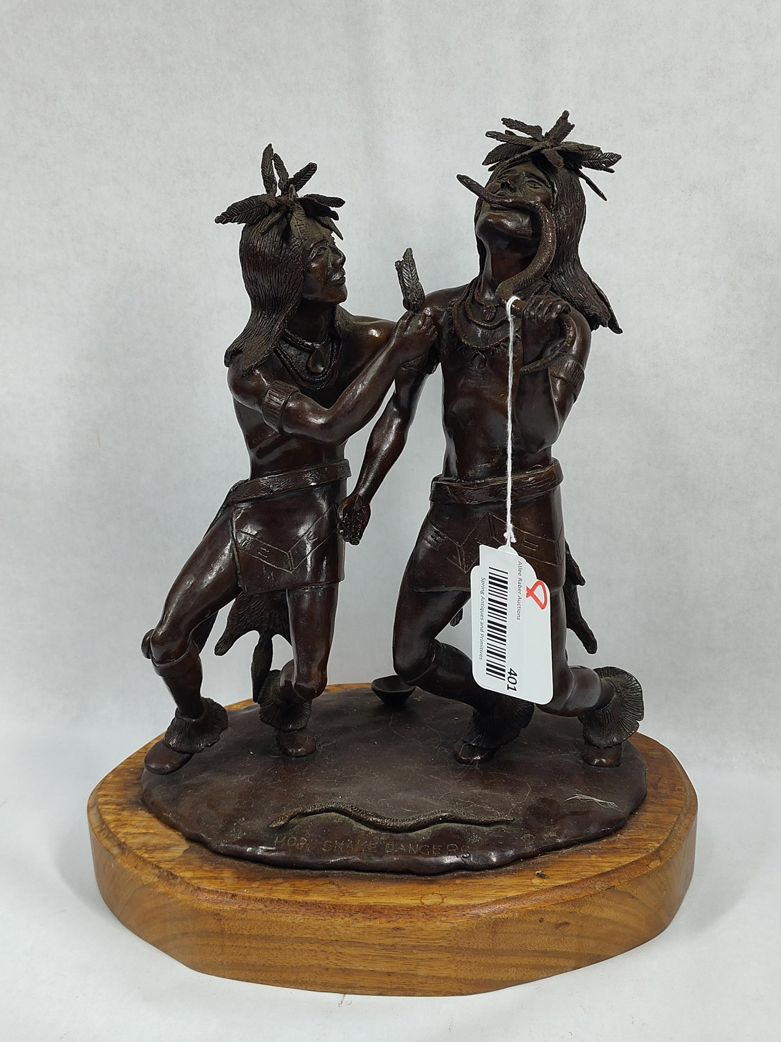 Garth Hopi Snake Dancers bronze sculpture: Bronze snake charming Native American figures on wooden base. Is signed Garth. In great condition!! Base 12.5in wide 9in deep 15.5in tall.