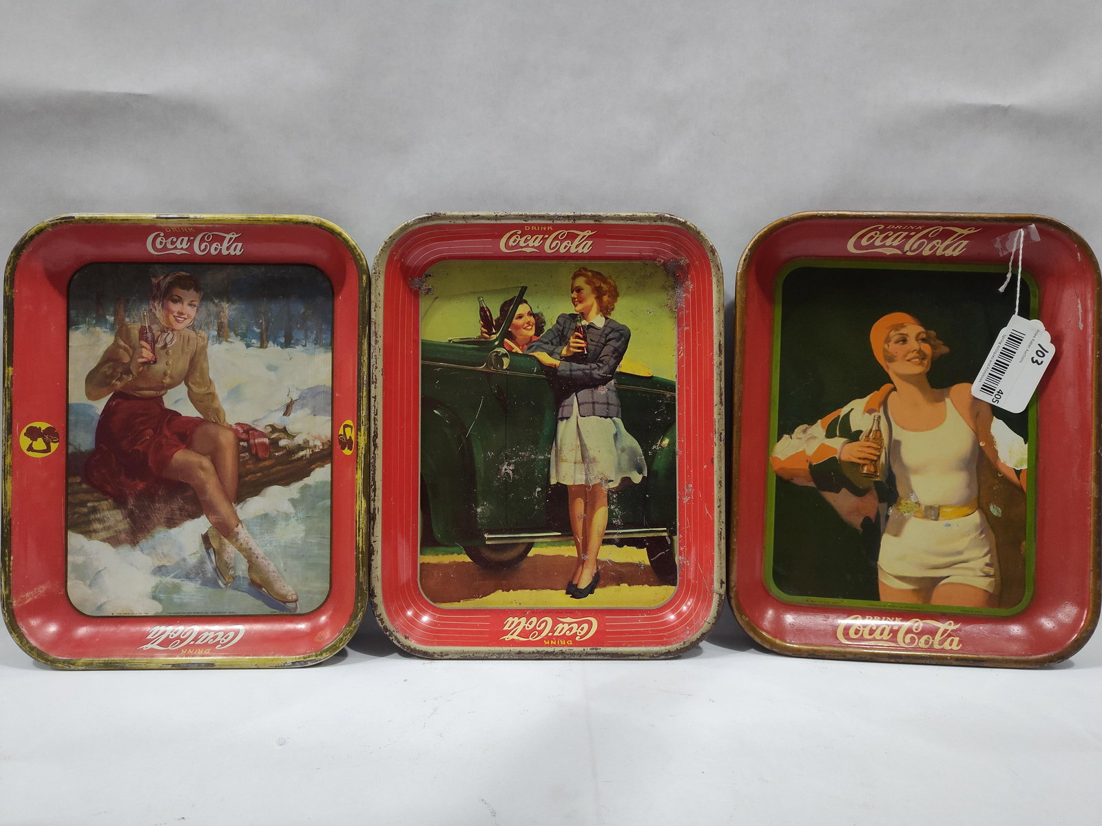 3-Early Coca-Cola Serving Trays: Includes a 1930 & 1941 by American Art Works. The 1930 appears to have areas of restoration. The other 2 show some condition but will display well.