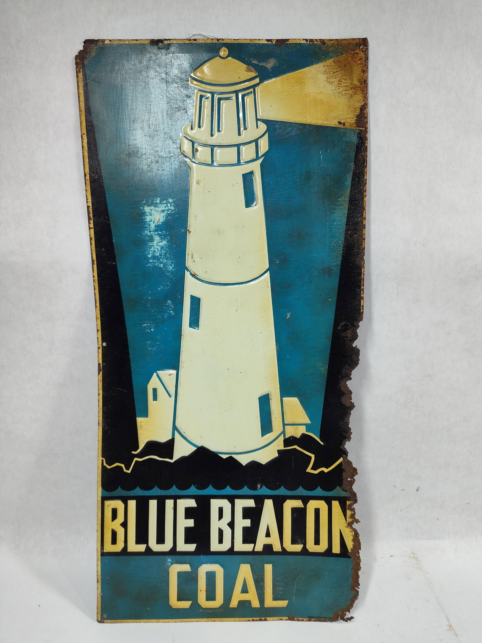 SST Blue Beacon Coal embossed sign: Old original 1-sided painted tin embossed sign with corrosion along edges and some discoloration in blue but is one you don't find everyday and with great lighthouse graphics!! Marked Donaldson