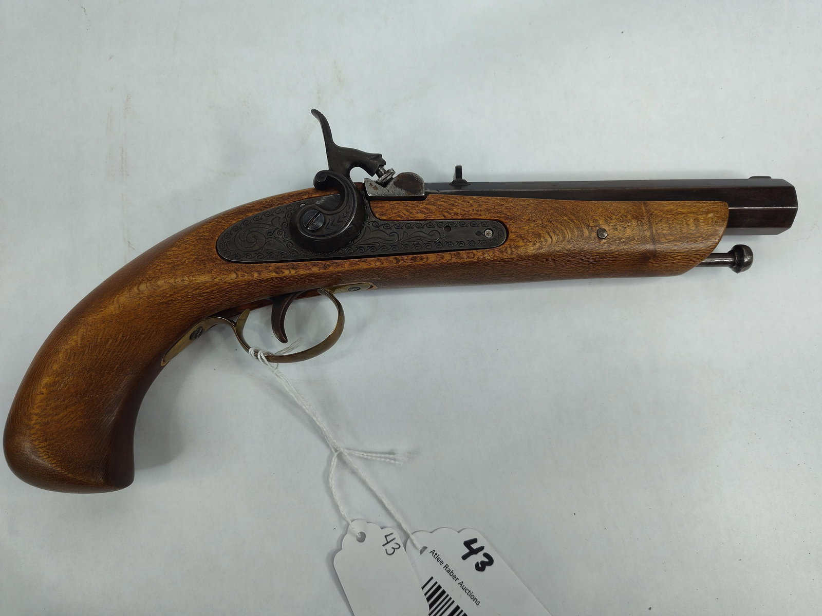 Spanish Jukar .45cal Black Powder Flintlock: Features an engraved receiver and 7in octagon barrel. Is missing a screw on top, otherwise in great condition! Overall length is 12.5in.