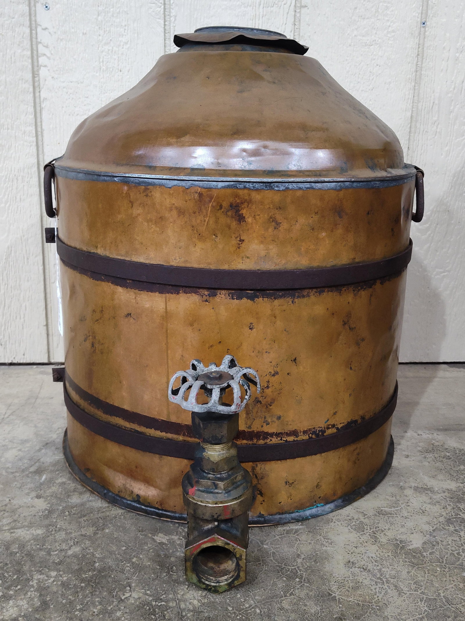 Early Copper Handled Vessel with Valve: Large iron banded copper vessel with 2 carrying handles and vertical handle in back. 18in diameter 21in tall.