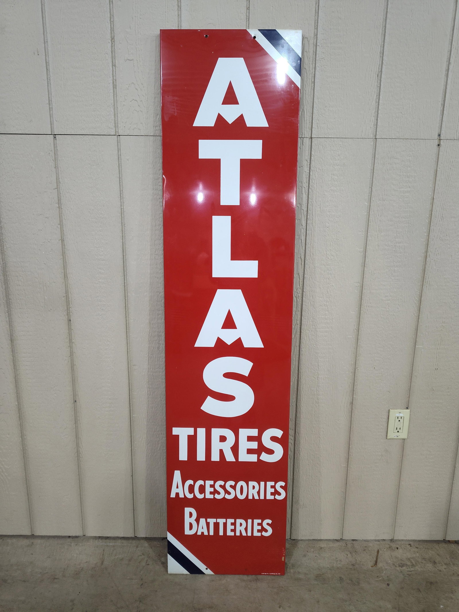 NOS SST Atlas Tires Accessories Batteries sign: New old stock 1-sided painted metal sign with wood frame backer. Shows a few cardboard marks from shelf stacking but overall in great clean condition!! 16.5in x 71in.