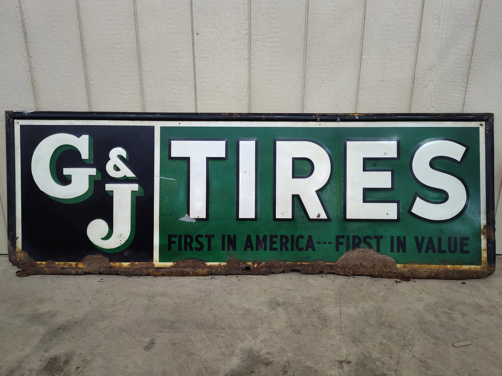 SST G&J Tires selframed sign: 1-sided painted metal self-framed sign with heavy corrosion along bottom Edge but still displays well! 24in X 73in.