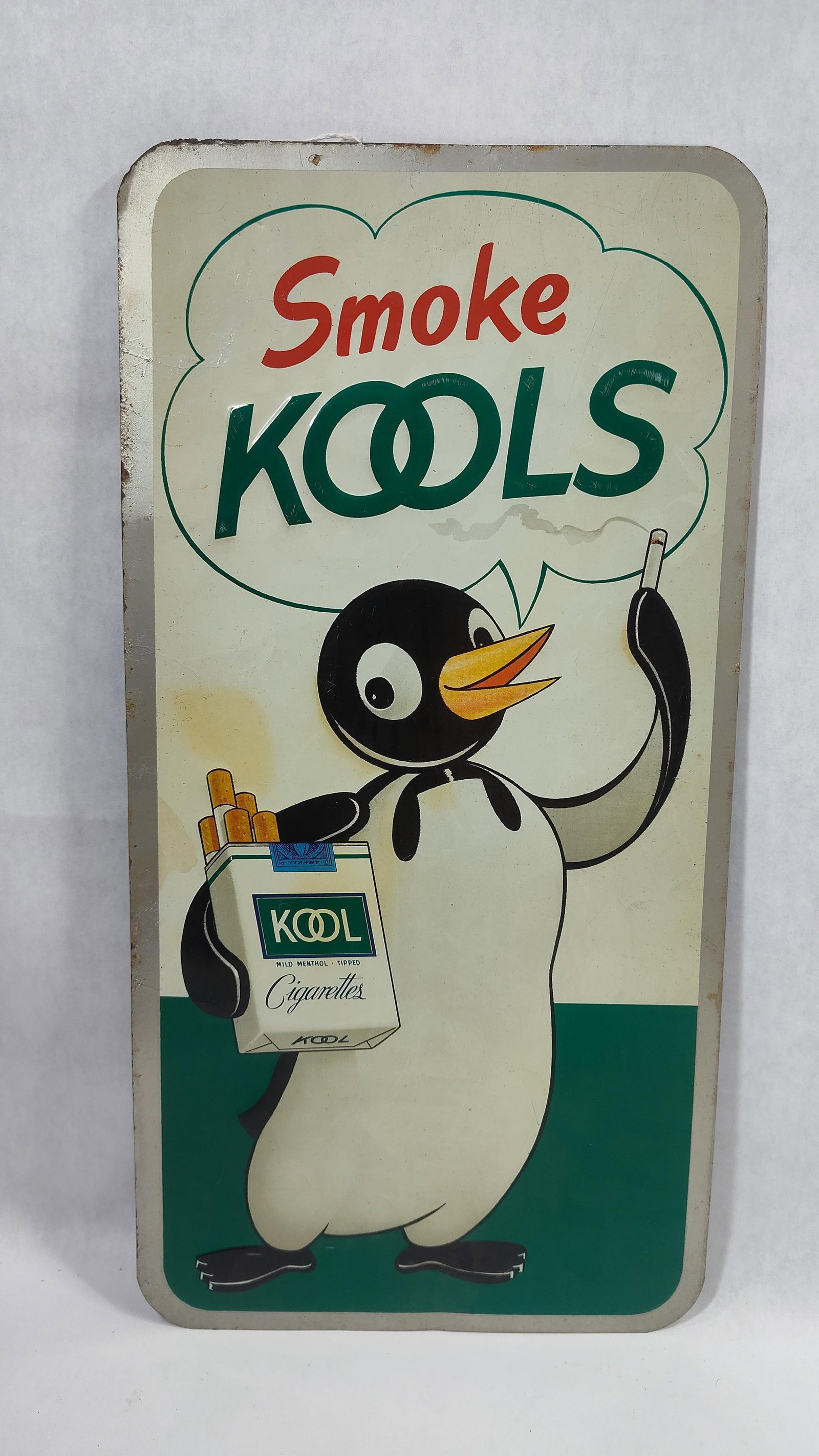 SST Kool Cigarettes sign: 1-sided painted tin sign with some edge wear, overall is pretty good! 8.5in x 16.5in.