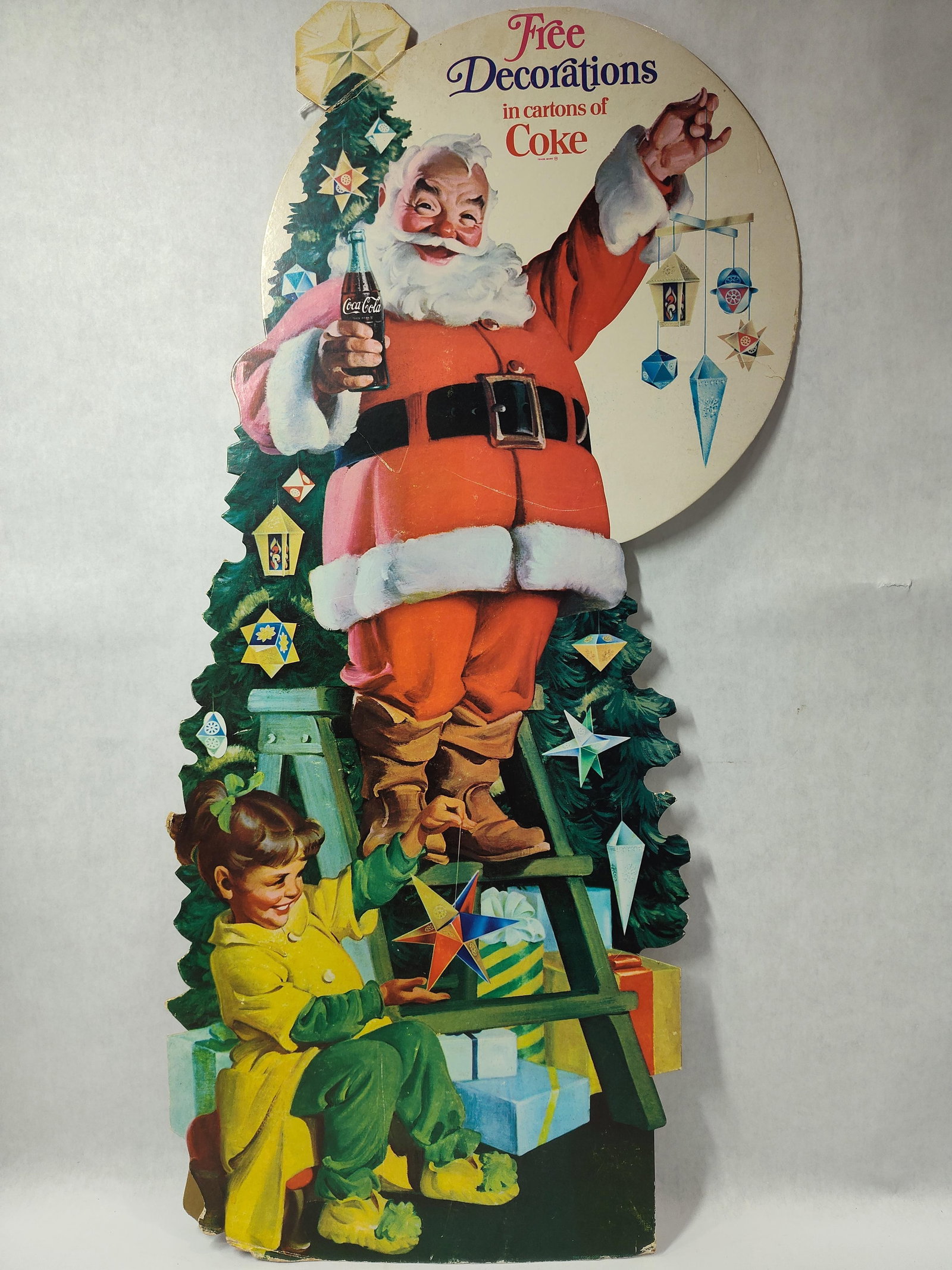 Free Decorations in cartons of Coke cdbd easelback sign: Shows edge wear and easelback has some separation but overall is decent. Approximately 15in x 30in.