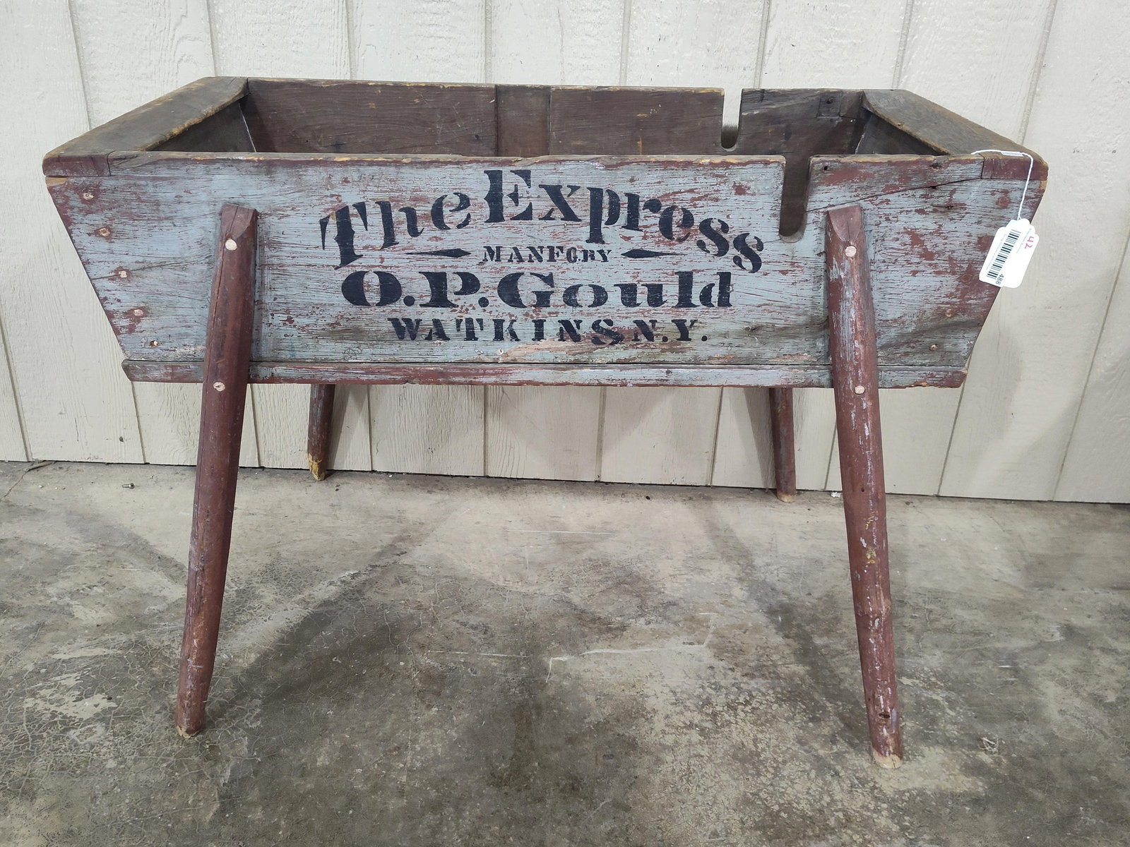 O.P. Gould The Express wooden wash tub: With excellent sharp graphics on all sides and awesome original paint!! 39in long 19in wide 27in tall.
