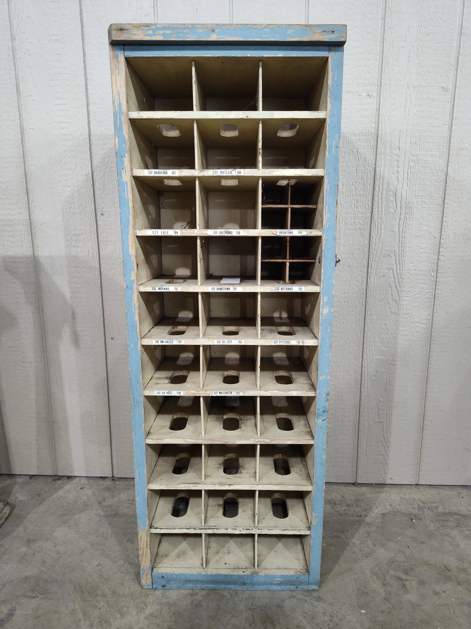 Primitive painted Dovetailed Postal Cabinet: Unusual early cubbie with dovetailed corners and nice Robin egg blue paint. Several slots are marked with PA towns or cities. 16.75in wide 12in deep 47in tall.