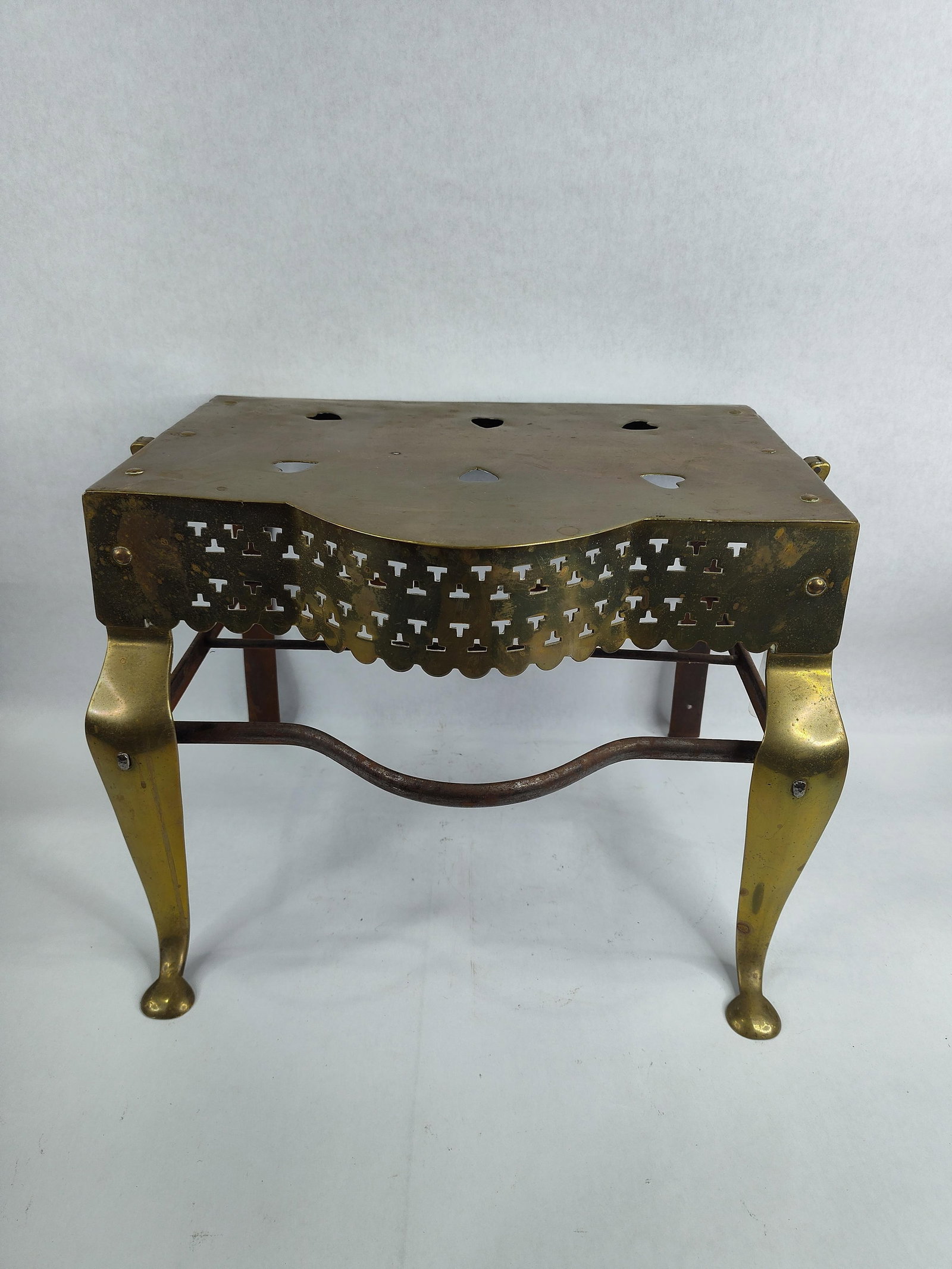English Brass & Iron Fireplace Footman: Historically used in front of a fireplace to keep kettles, pots, or dishes warm before serving.?16in long 12in wide 12.5in tall.