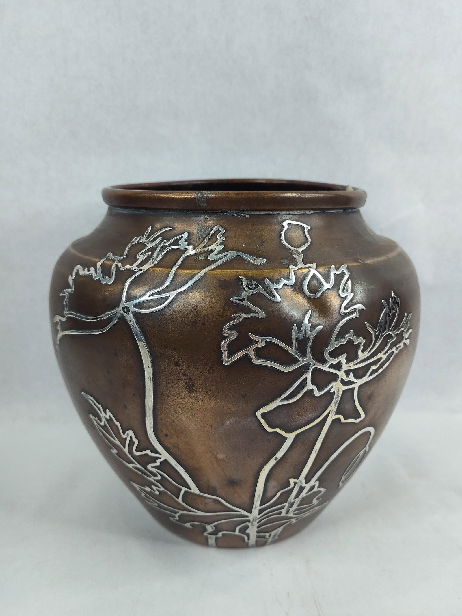 Heintz Sterling on Bronze Urn/Vase: Is marked on bottom Sterling on Bronze. 8in diameter 8in tall.