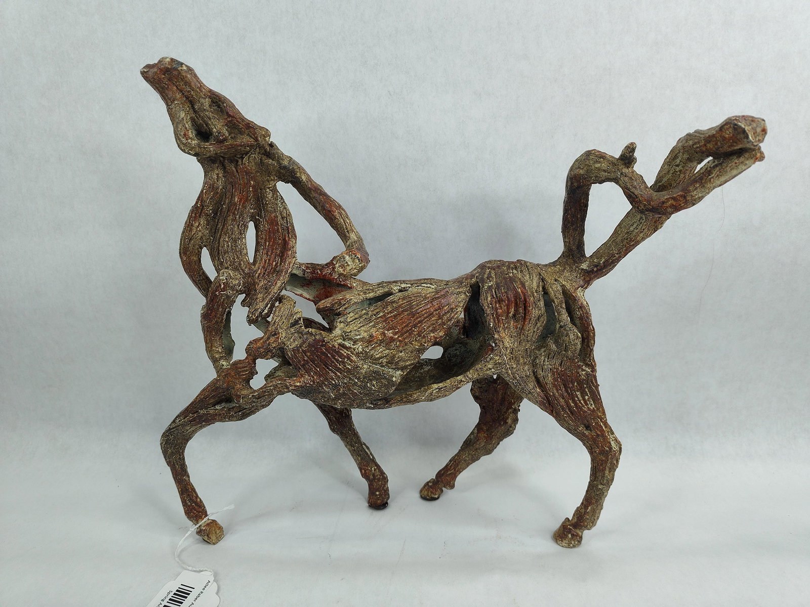 Deborah Butterfield Horse Sculpture: Cast bronze or metal imitating driftwood with a patina finish. Beautiful modern 3 dimensional look!! 13in long 13in tall.