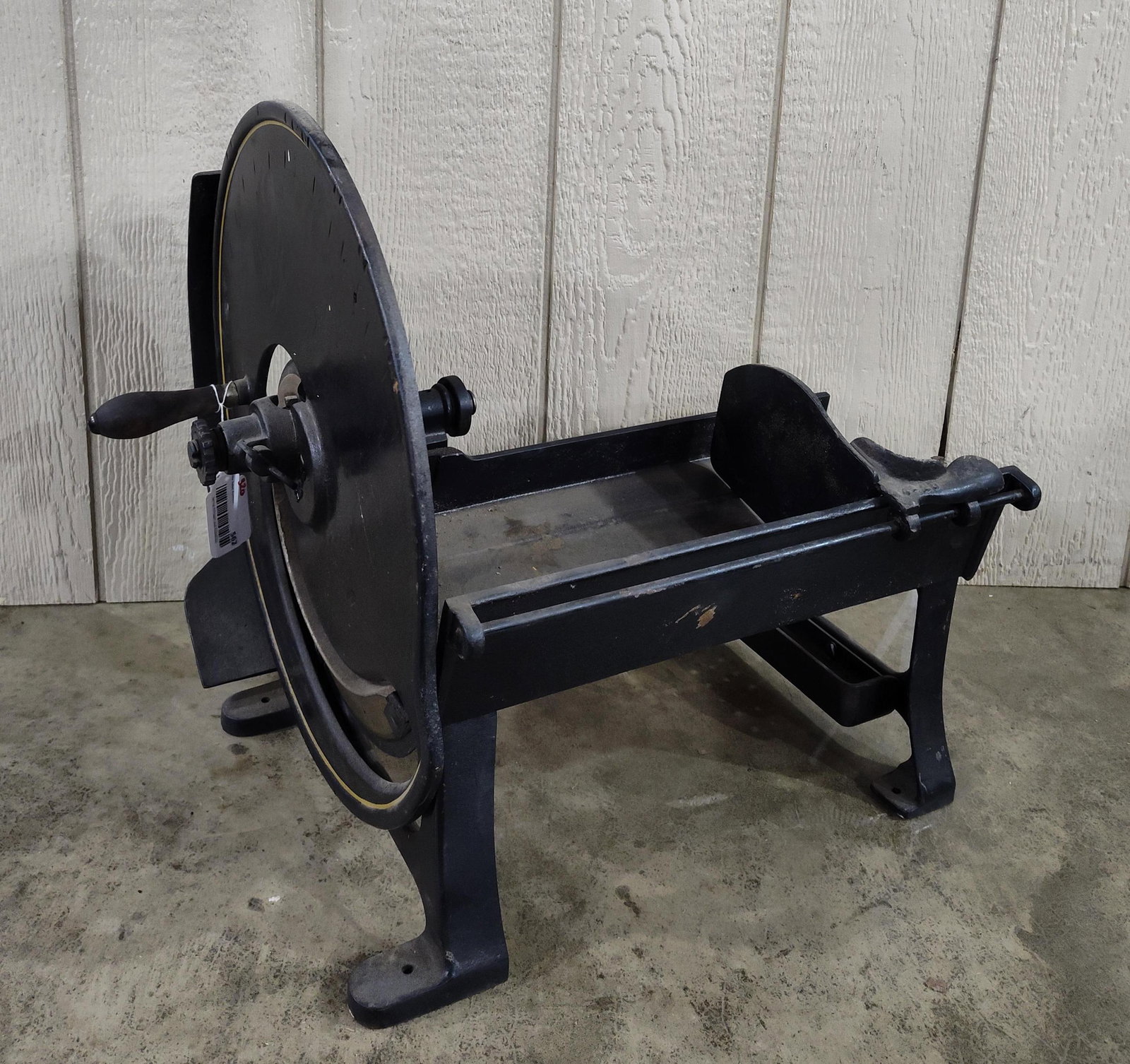 Early Industrial Heavy Cast Iron Slicer: Has been repainted at some point and in good solid condition! Unmarked piece. Only markings found are 45-25 on crank wheel and 44-25 adjustable slider on table surface. Wheel is 19in diameter. 18in