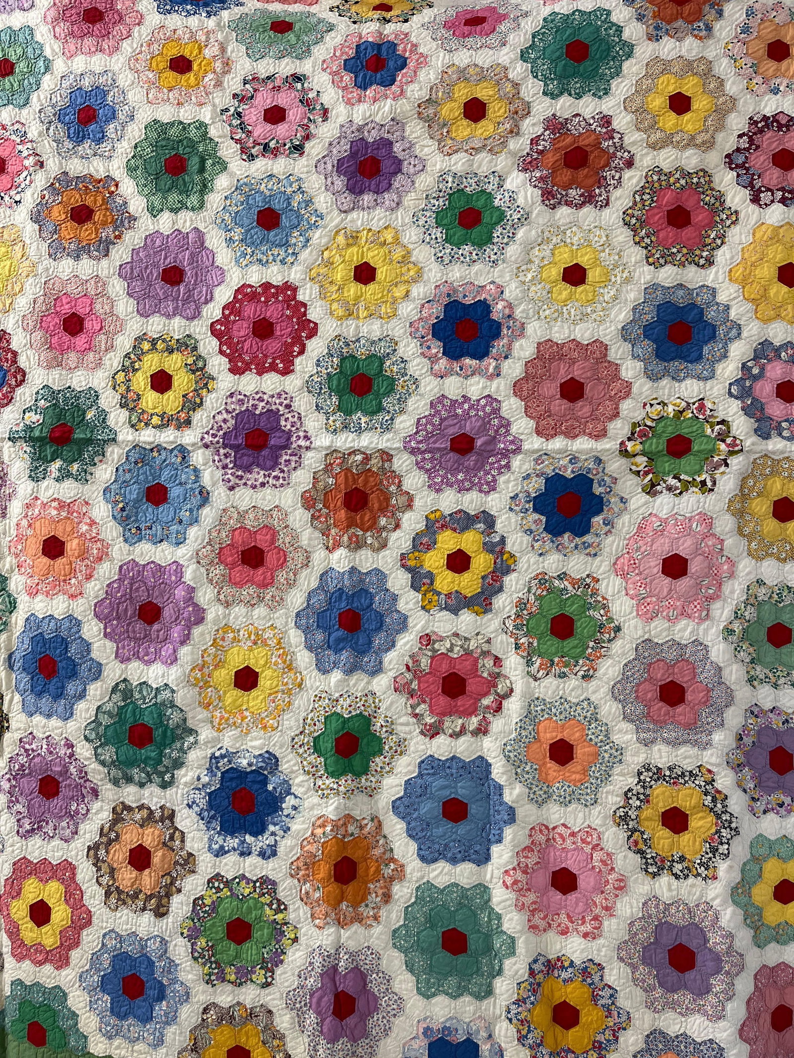 Grandmother Flower Garden Handstitched Quilt: A nice early pattern with vibrant color. minor stains but no large rips or damage. 72x85