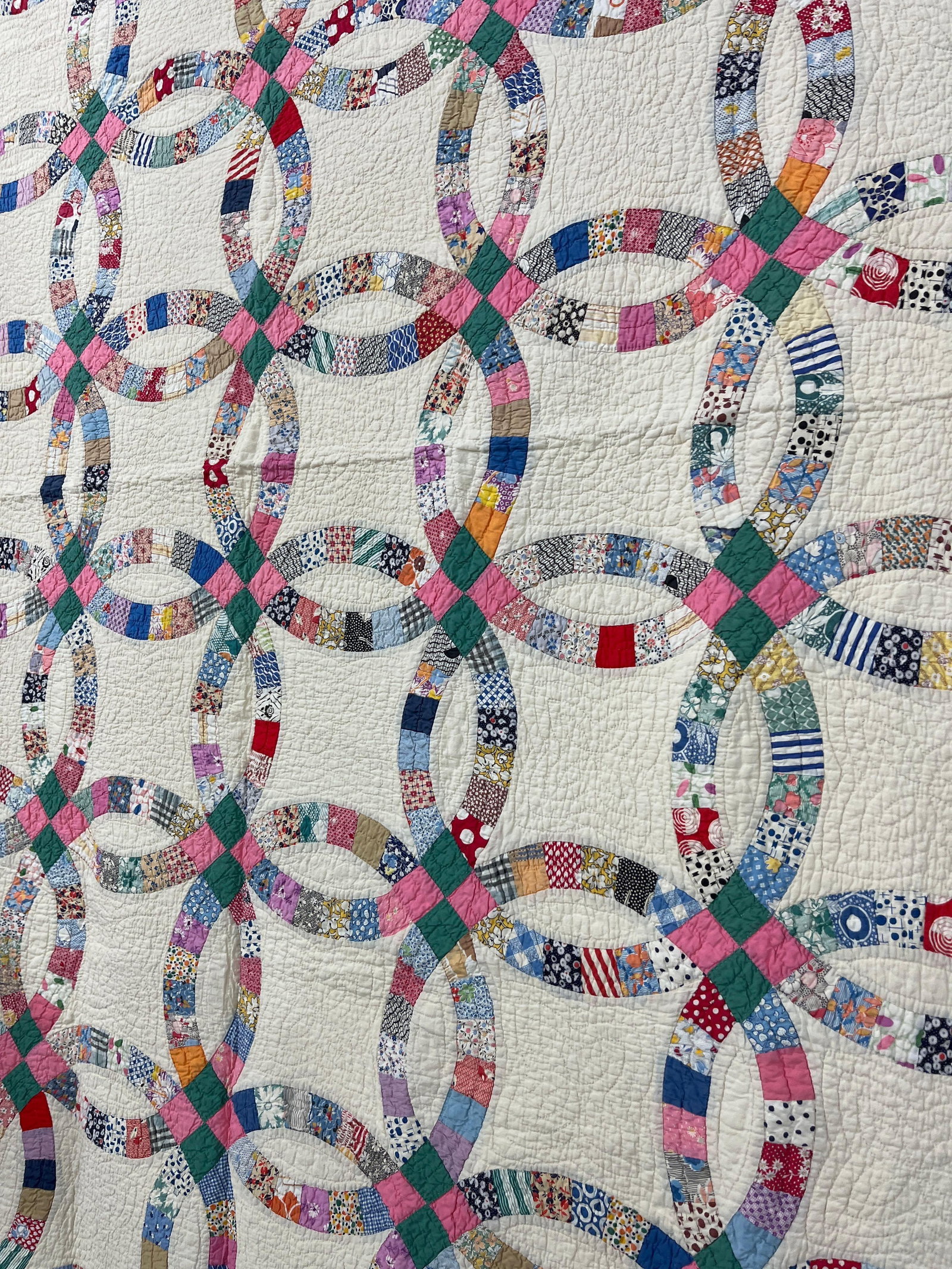 Double Wedding Ring Quilt: An early hand stitched quilt, minor staining from age. 82x67