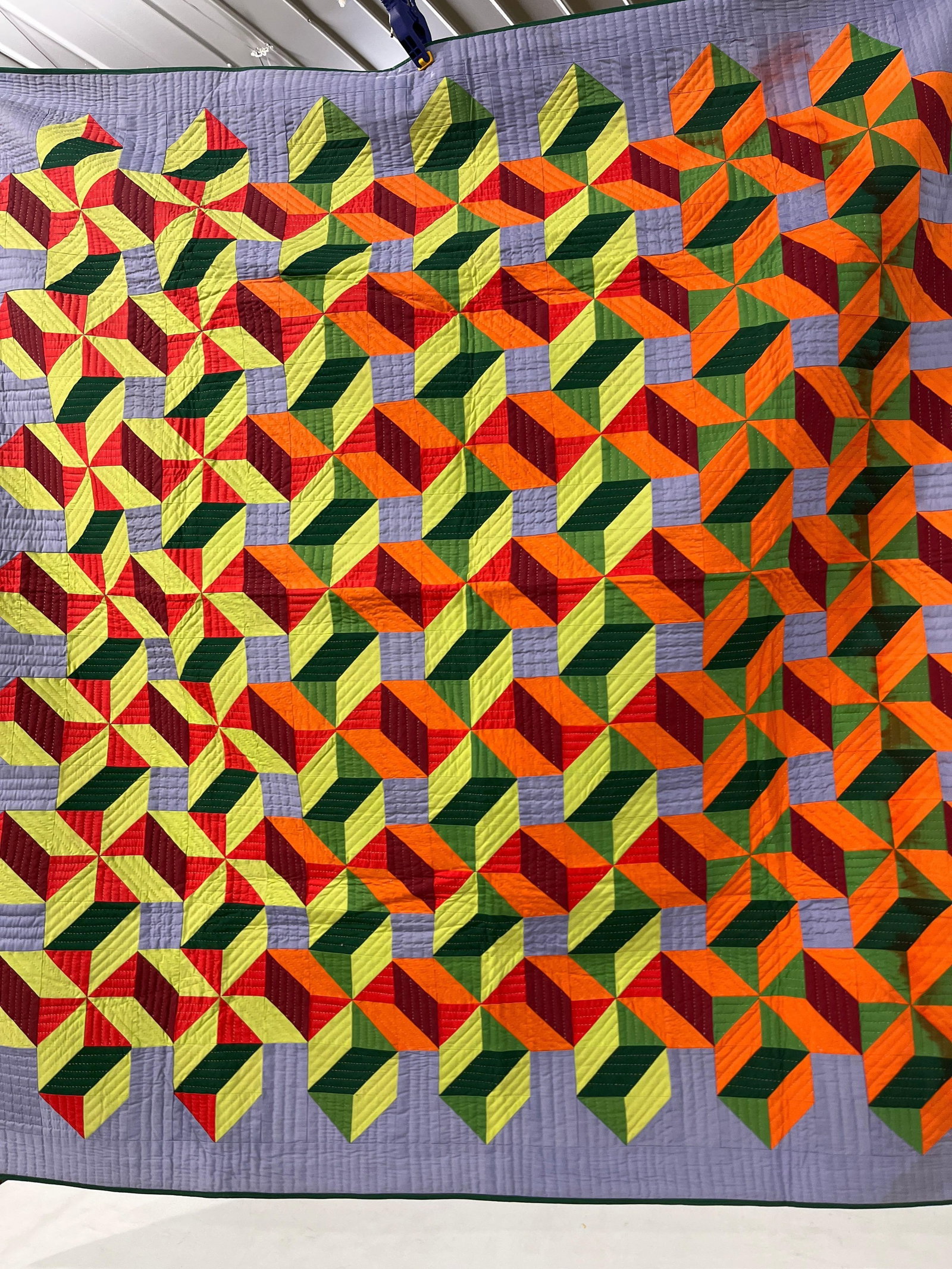 Hand Stitched Entangled Sky Pattern Quilt: This geometric pattern really pops. Vibrant color does sow some color bleed as seen . Machine and hand stitched 71x71