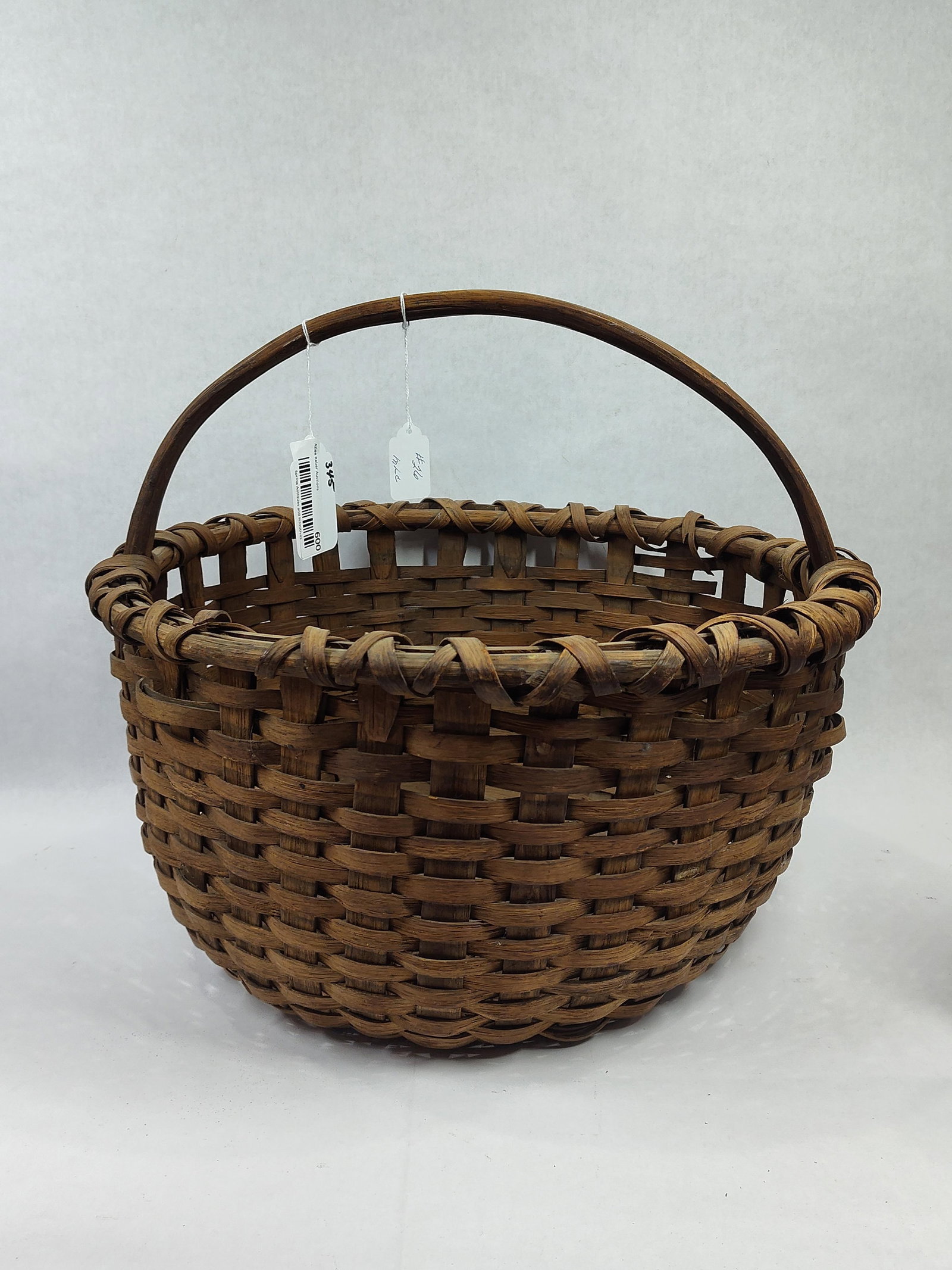Primitive Woven Splint Basket: Shows a few minor imperfections but overall is in decent condition. 17.5in diameter 10in tall.