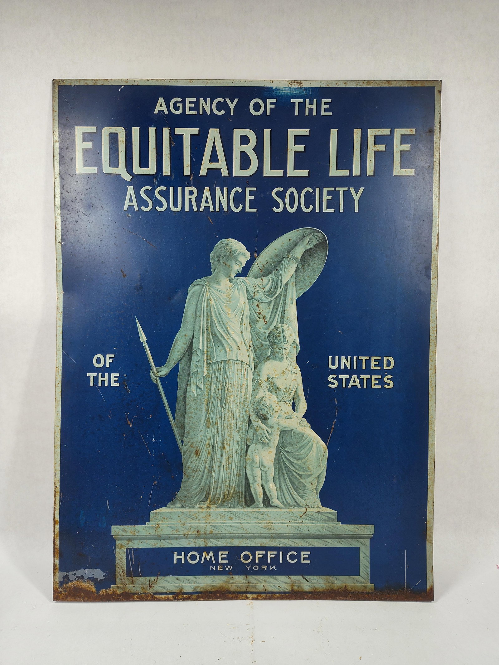 SST Equitable Life Assurance Society sign: 1-sided painted metal sign that originally had a cardboard backer but is missing. Nice graphical sign with some edge wear and surface corrosion. 17in x 23.5in.