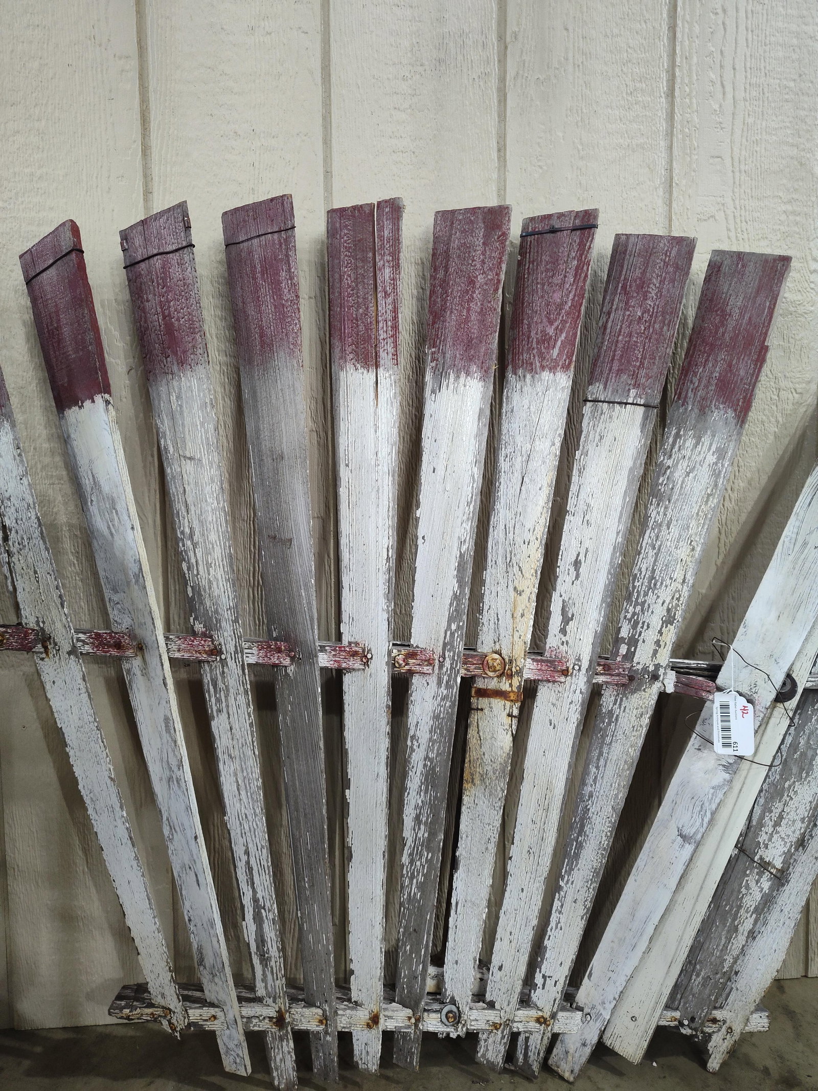 Primitive Windmill Fan: Part of a windmill fan. Has one loose slat. Approximately 48in wide 38in tall.