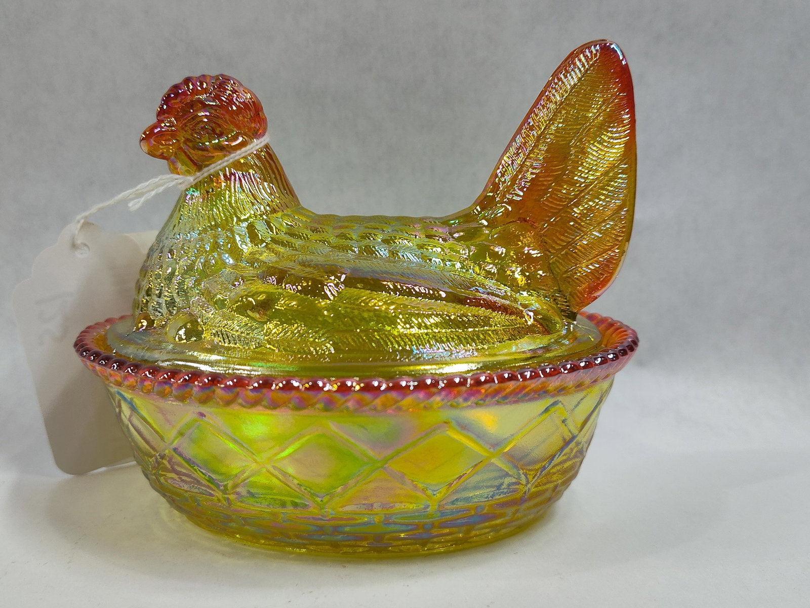VTG West Moreland Glass Marigold Carnival Glass Hen on Nest Covered Dish: Showing no chips, cracks or breaks measuring 6 in. L 